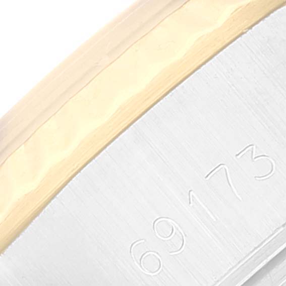 This close-up image shows the side of a Rolex Datejust 69173 Women's Steel and Gold (two tone) Champagne Dial 69173 Women's Steel and Gold (two tone) Champagne Dial watch, focusing on the model number engraved on the case.