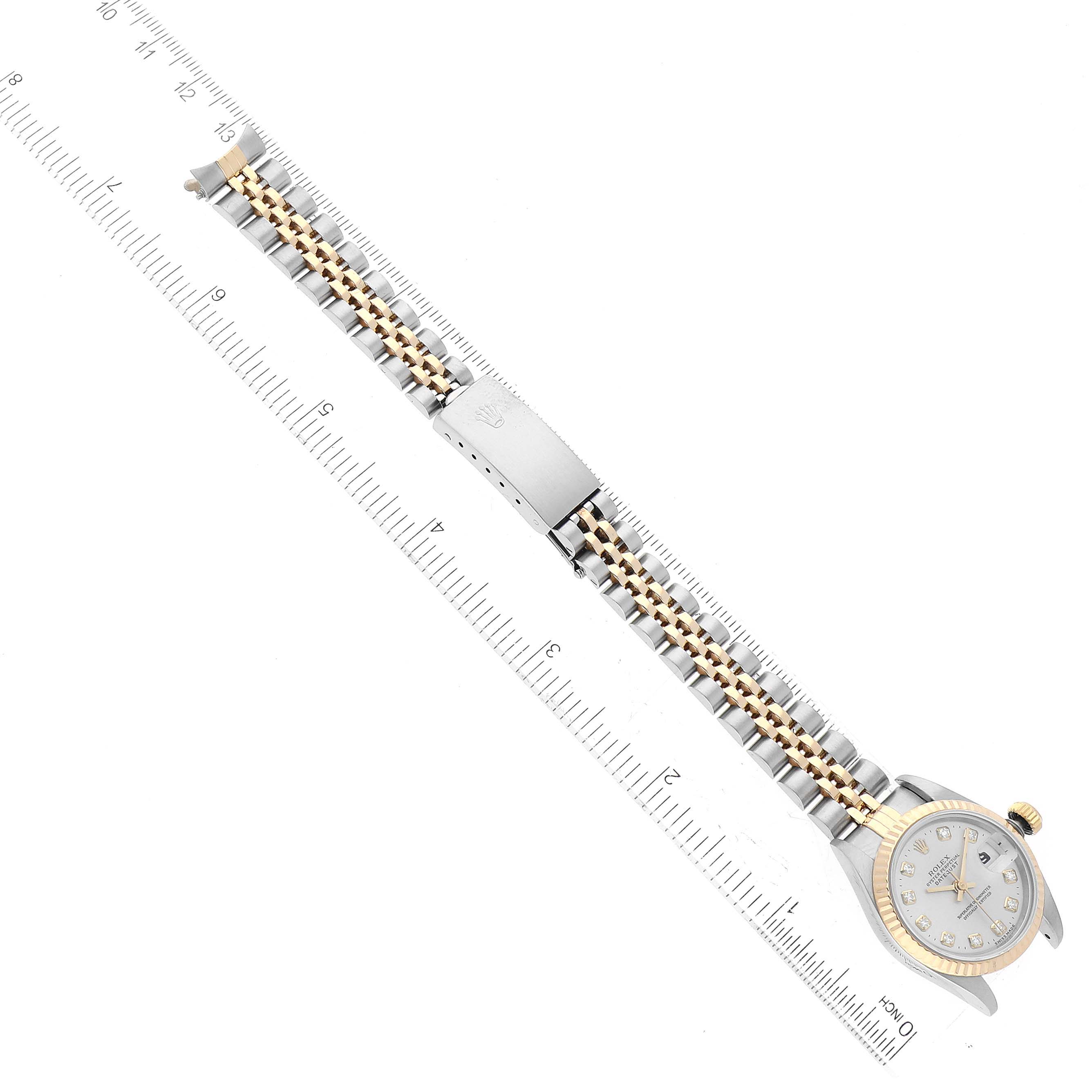 This image shows a top-down view of a Rolex Datejust 69173 Women's Steel and Gold (two tone) Silver Dial 69173 Women's Steel and Gold (two tone) Silver Dial watch, including the dial, bezel, crown, and bracelet with a clasp.