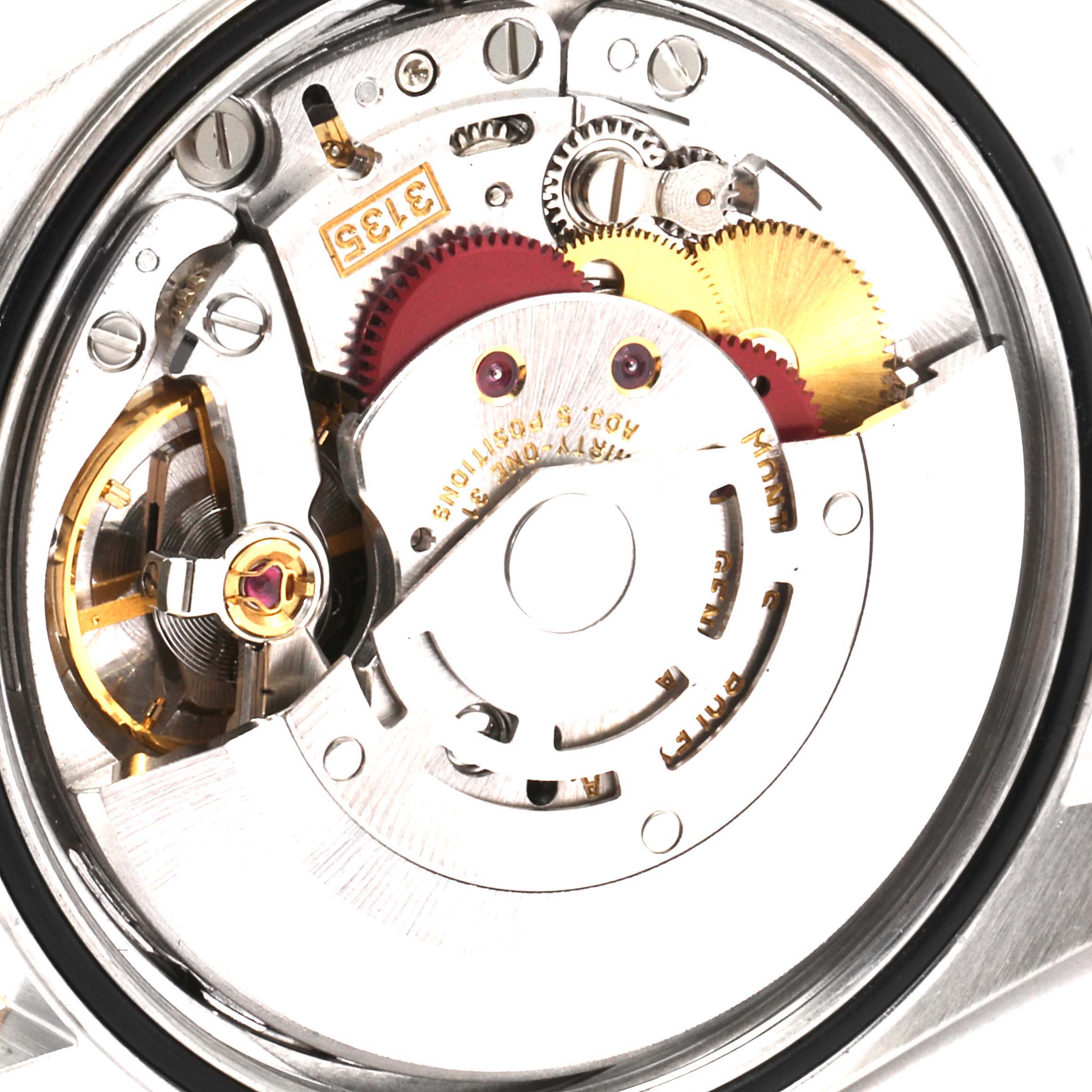 This image shows a close-up of the Rolex Datejust 16233 Men's Steel and Gold (two tone) White Dial 16233 Men's Steel and Gold (two tone) White Dial movement mechanism from the back, highlighting gears and components.