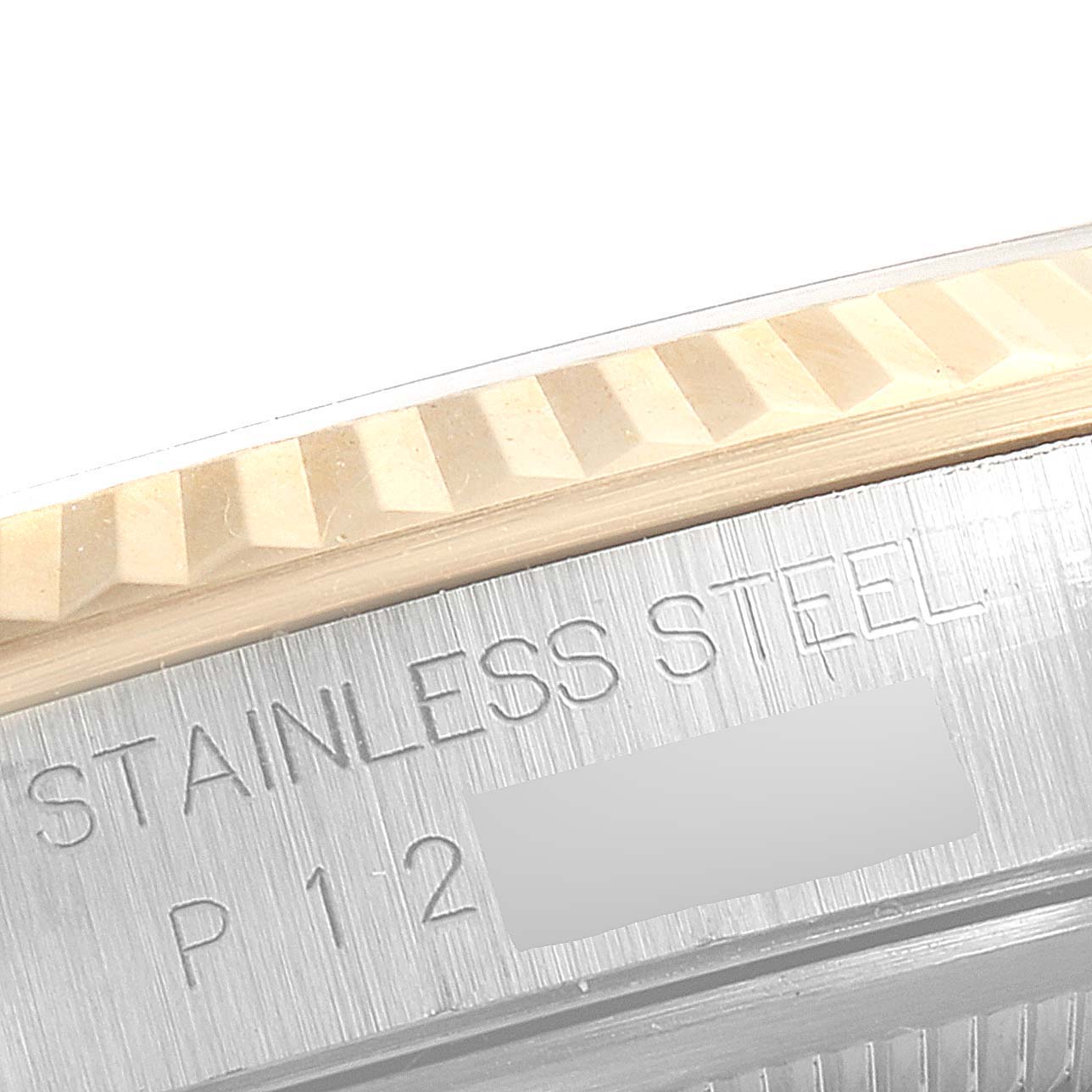 This close-up angle of the Rolex Datejust 16233 Men's Steel and Gold (two tone) White Dial 16233 Men's Steel and Gold (two tone) White Dial shows the fluted bezel and the engraved text "STAINLESS STEEL".