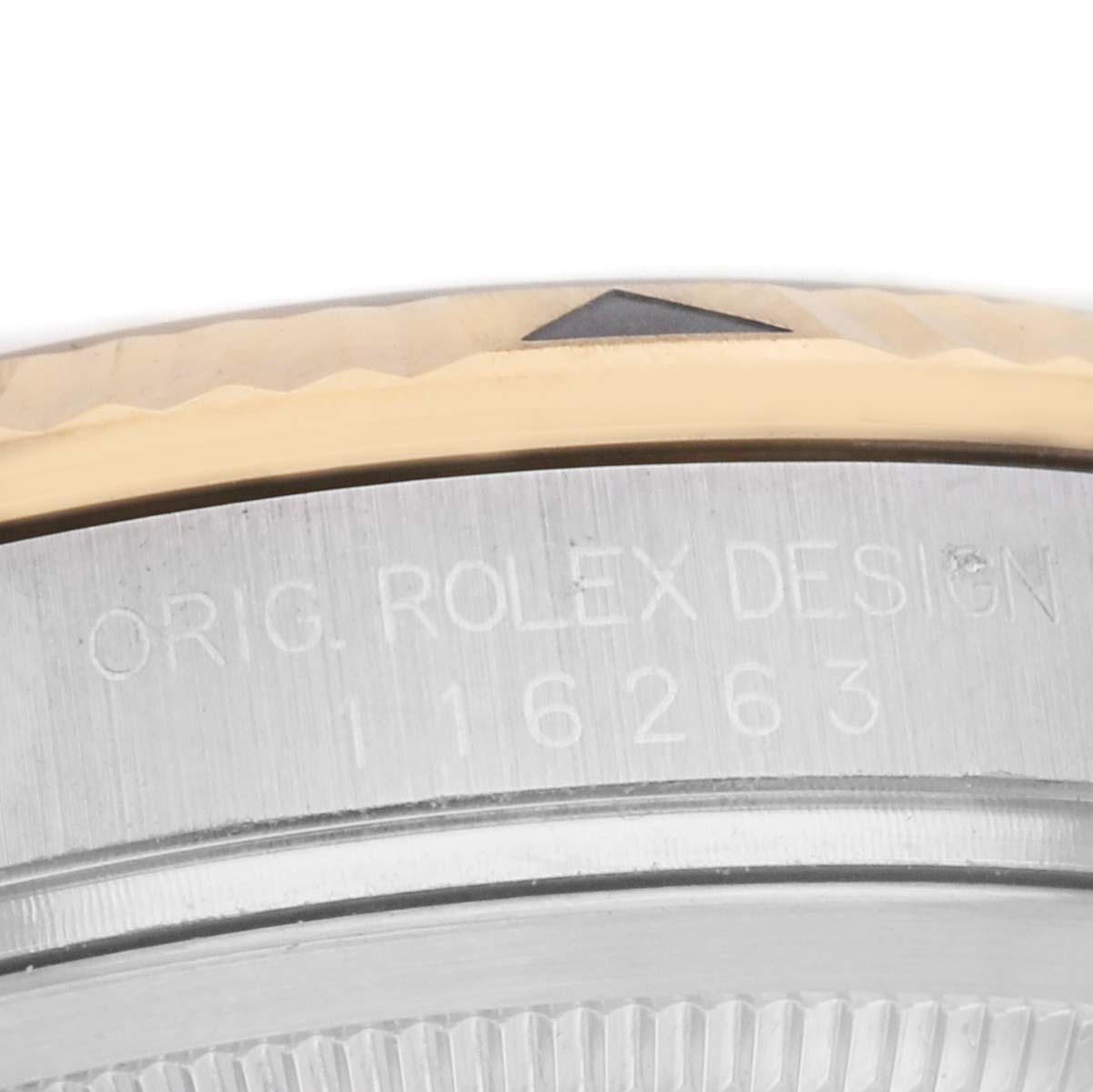 The image shows a close-up of the side of a Rolex Turn-o-Graph 116263 Men's Steel and Gold (two tone) Champagne Dial, focusing on the bezel and engraved model number.