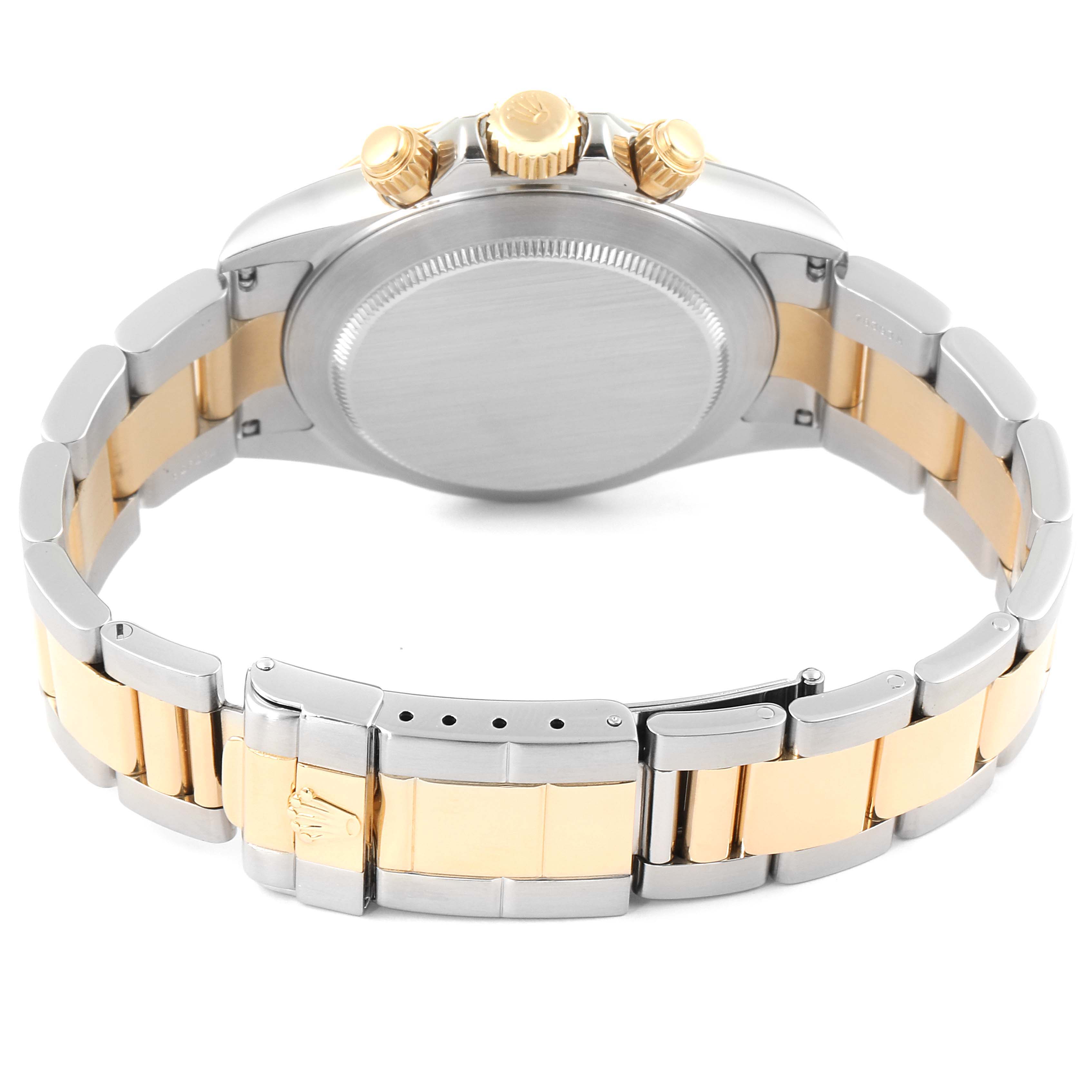 This image shows the back view and clasp of a Rolex Daytona 16523 Men
s Steel and Gold (two tone) Champagne Dial 16523 Men
s Steel and Gold (two tone) Champagne Dial watch, highlighting its two-tone bracelet and crown.