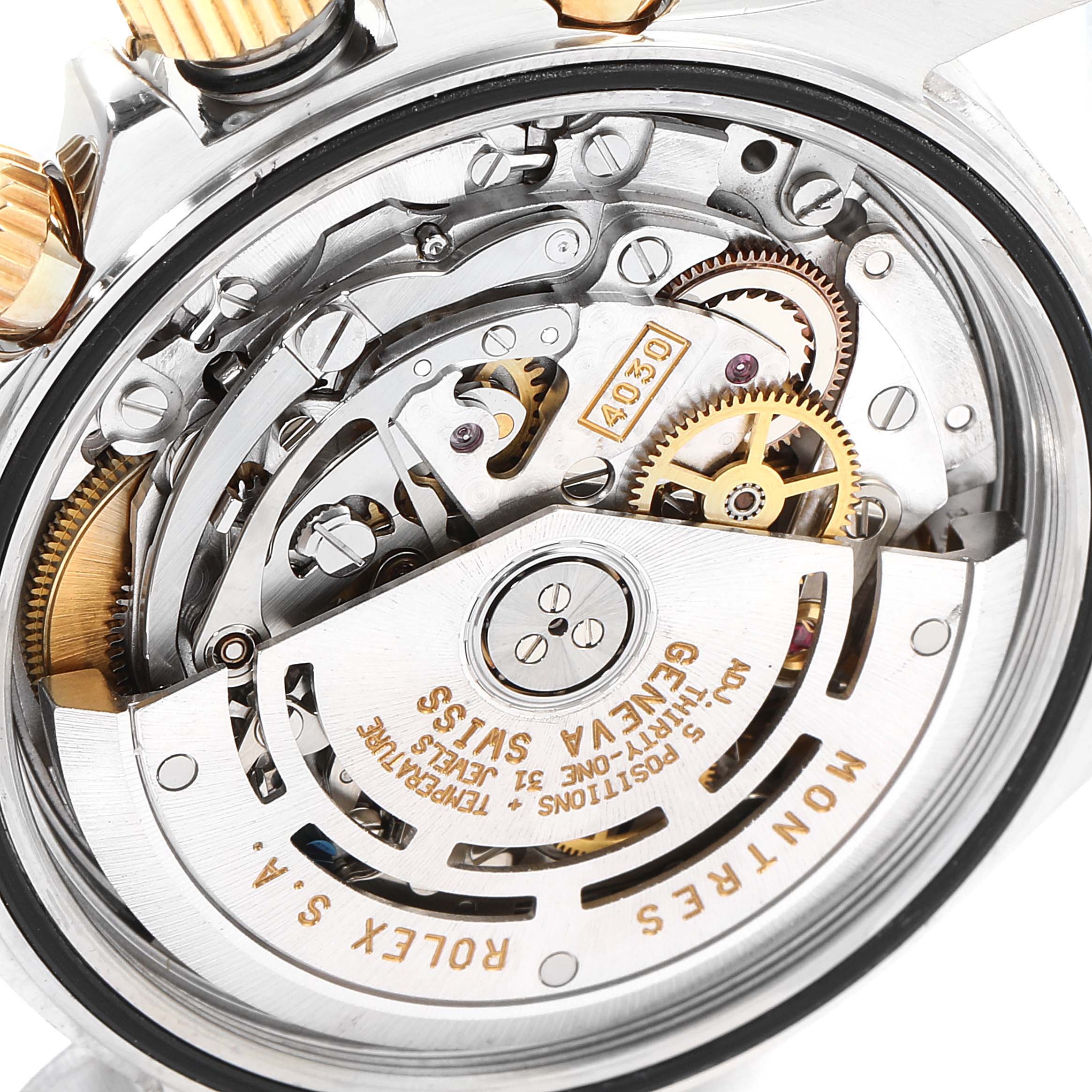 This is a close-up view of the movement mechanism of a Rolex Daytona 16523 Men
s Steel and Gold (two tone) Champagne Dial 16523 Men
s Steel and Gold (two tone) Champagne Dial watch displaying its intricate inner workings.