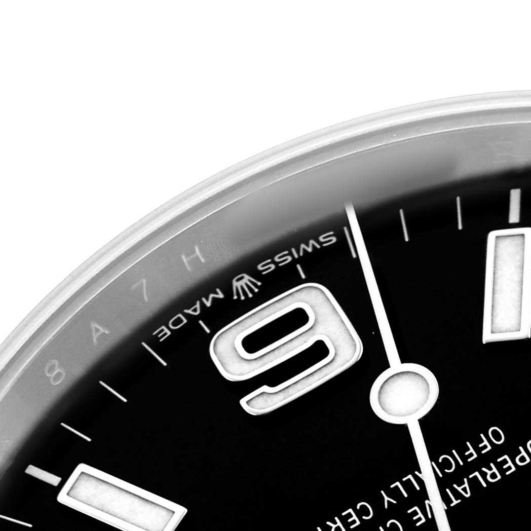 The close-up image shows the dial of a Rolex Explorer 224270 Men's Stainless Steel Black Dial, highlighting the "9" marker and part of the minute hand.