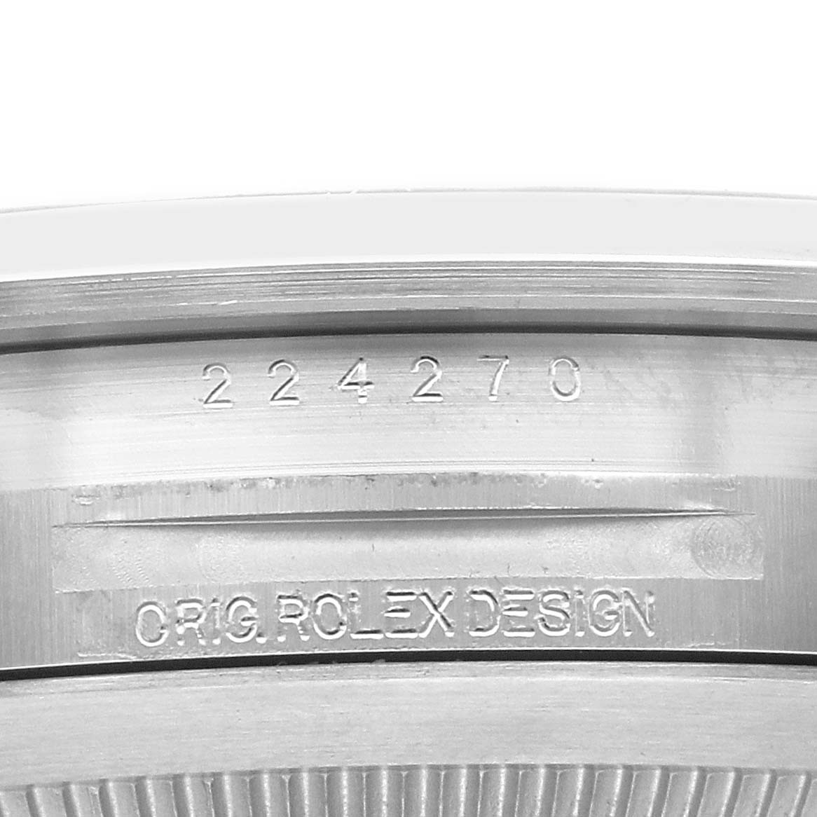 The image shows the case back edge of a Rolex Explorer 224270 Men's Stainless Steel Black Dial, featuring engraved model and design details.