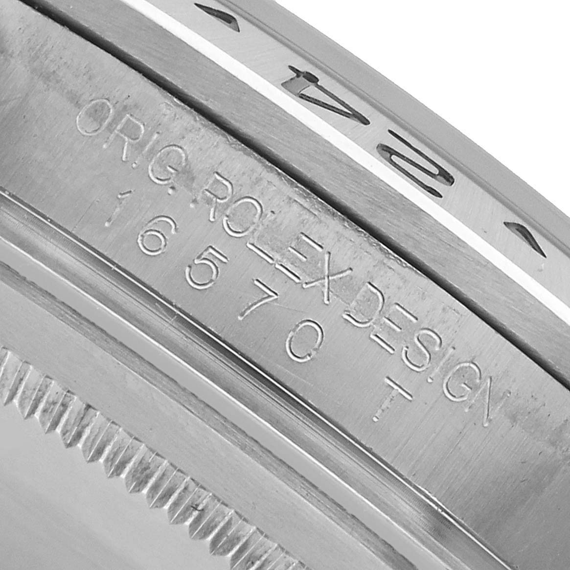 The image shows a close-up of the side of the Rolex Explorer 16570 Men's Stainless Steel White Dial, highlighting its engraved design details and bezel.