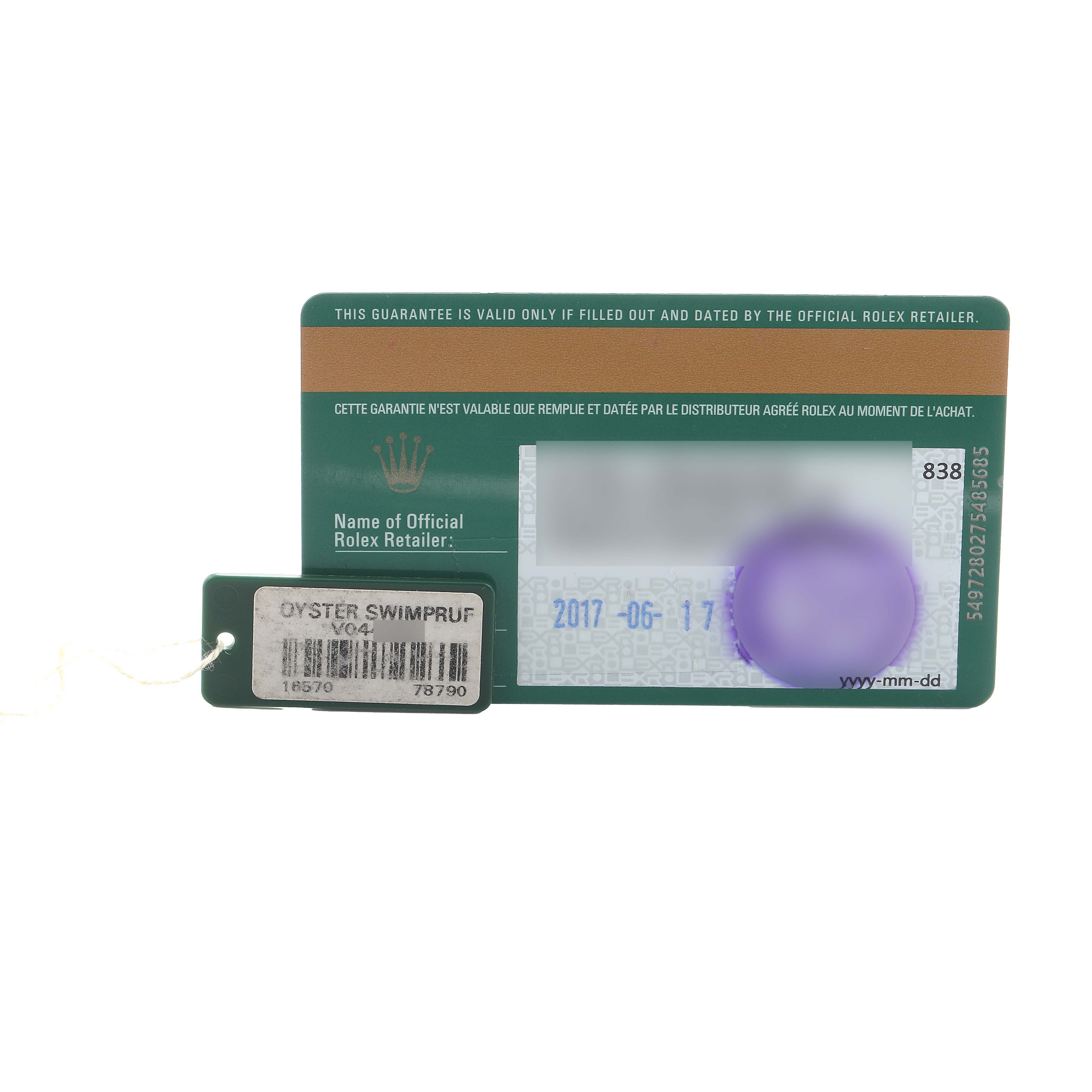 The image shows a Rolex Explorer 16570 Men's Stainless Steel White Dial warranty card and attached tag with model and serial numbers visible.