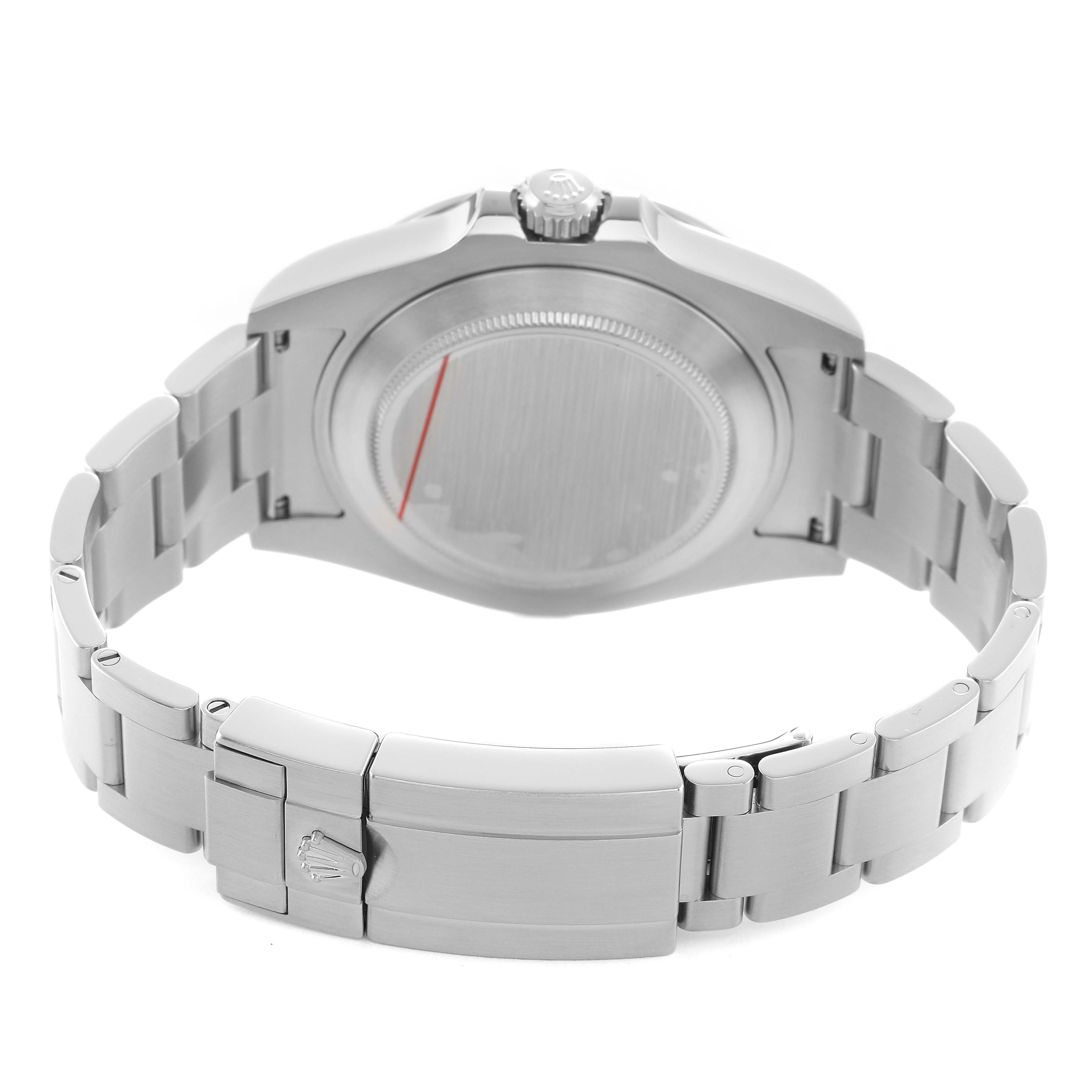 The image shows the back case, crown, and clasp of a Rolex Explorer 216570 Men's Stainless Steel White Dial watch from a rear angle.