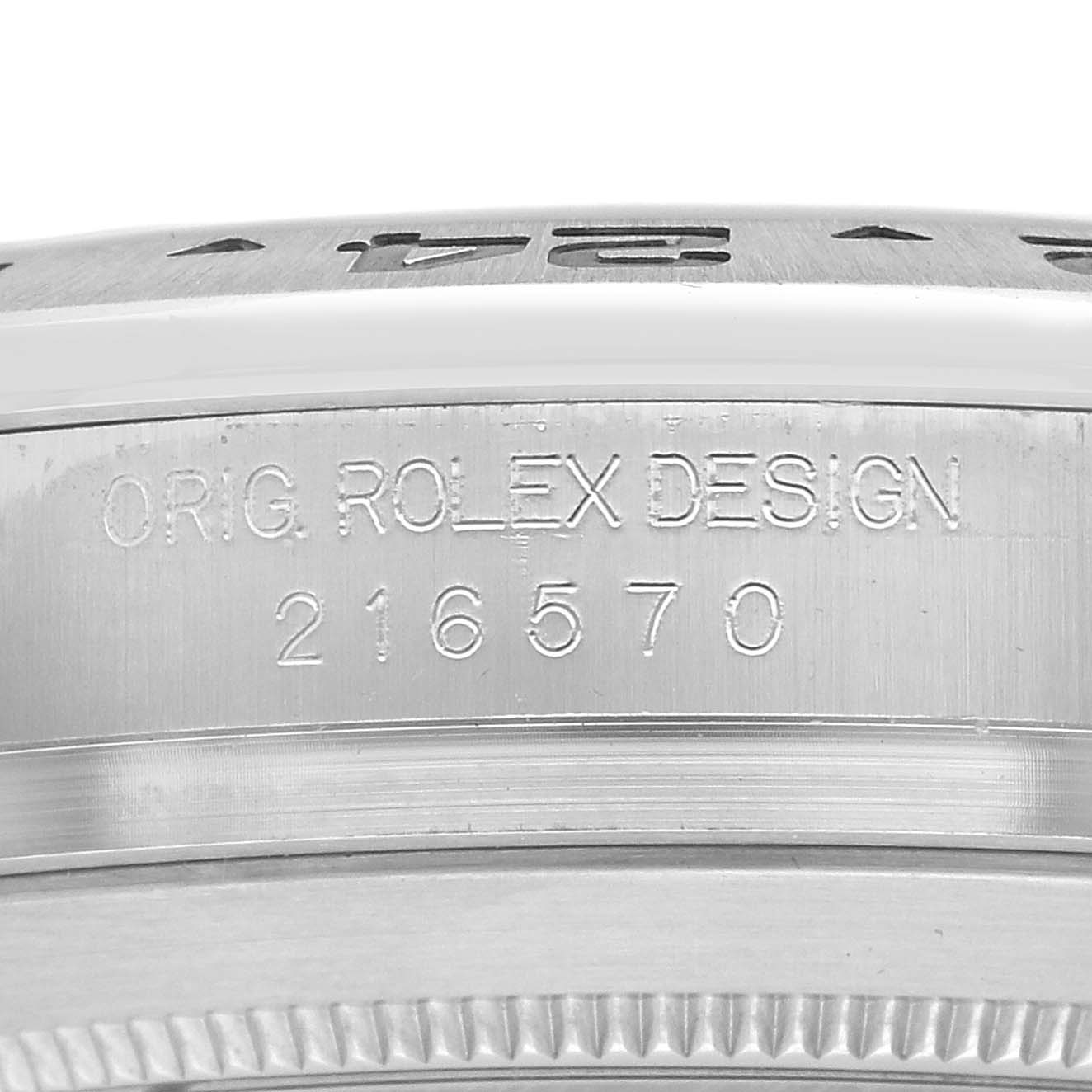The image shows a close-up of the Rolex Explorer 216570 Men's Stainless Steel White Dial's case side, displaying the model number and engravings.