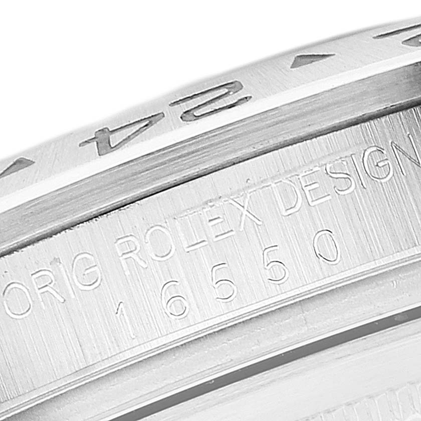 Close-up of the bezel and engraved case side of a Rolex Explorer 16550 Men's Stainless Steel Black Dial 16550 Men's Stainless Steel Black Dial watch.
