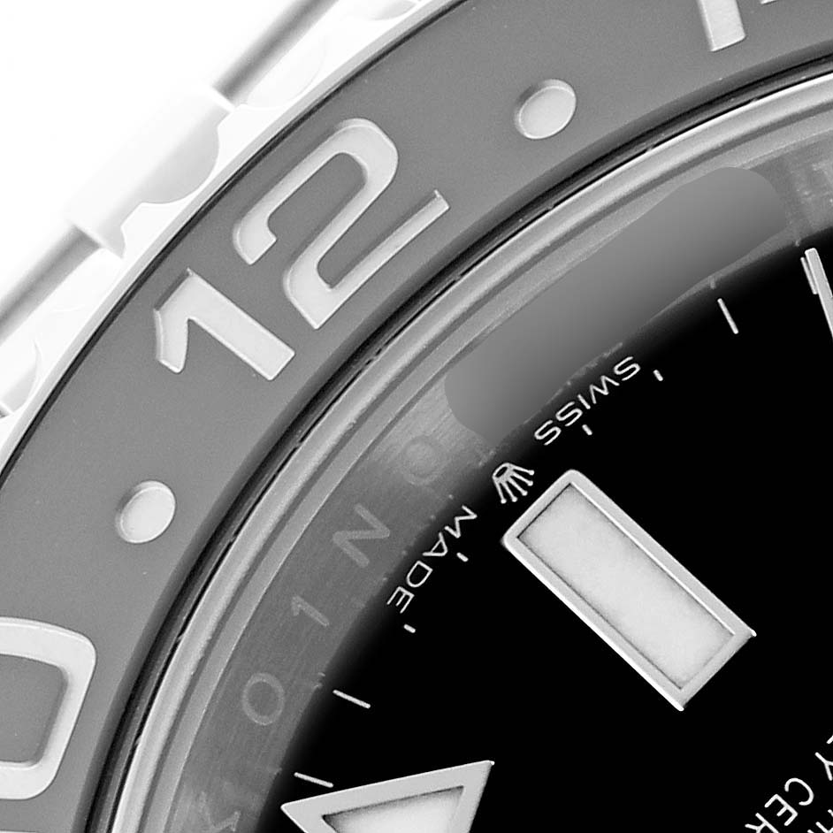 The image shows a close-up of the bezel and dial of a Rolex GMT-Master 126710 Men's Stainless Steel Black Dial watch, focusing on the 12 o'clock mark.