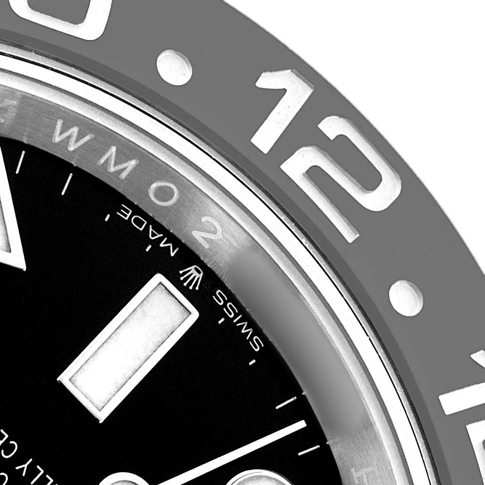 The image shows a close-up of the bezel and partial dial of a Rolex GMT-Master 126710 Men's Stainless Steel Black Dial, highlighting the numbers and markers.
