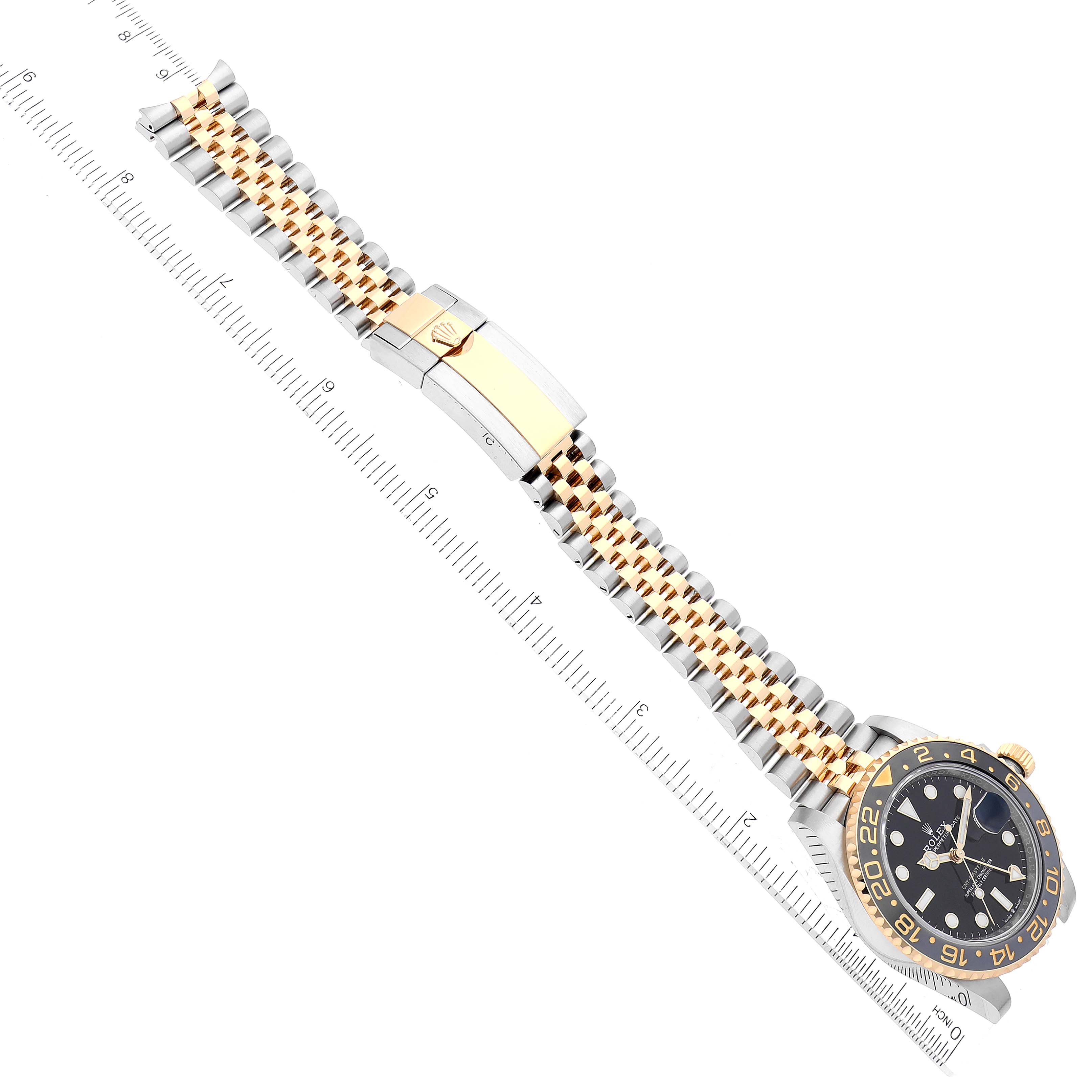 The image shows a Rolex GMT-Master 126713 Men's Steel and Gold (two tone) Black Dial 126713 Men's Steel and Gold (two tone) Black Dial watch, including the face and full bracelet, with a ruler for scale.