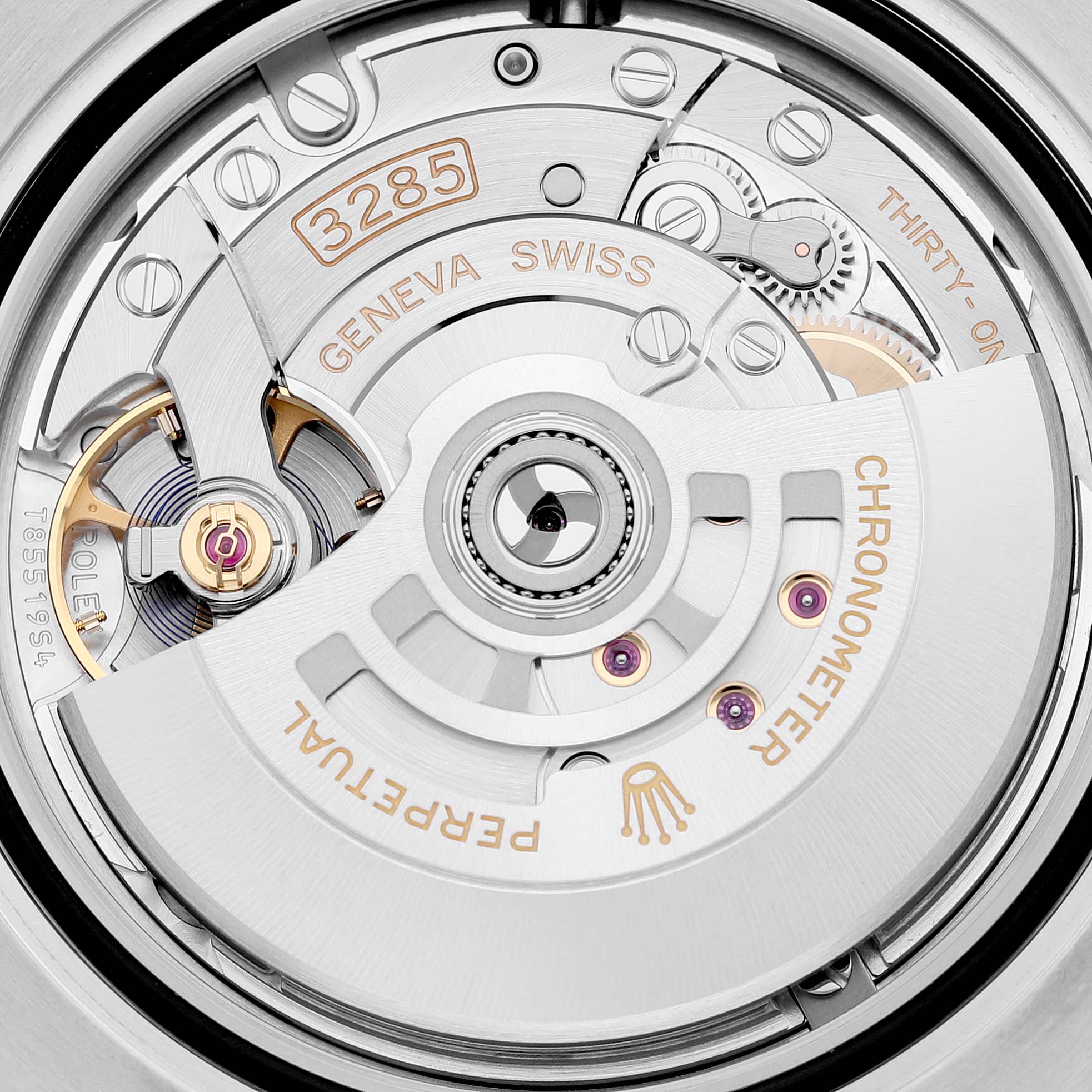 The image shows a close-up of the movement mechanism of a Rolex GMT-Master 126713 Men's Steel and Gold (two tone) Black Dial 126713 Men's Steel and Gold (two tone) Black Dial watch, revealing intricate watch components.