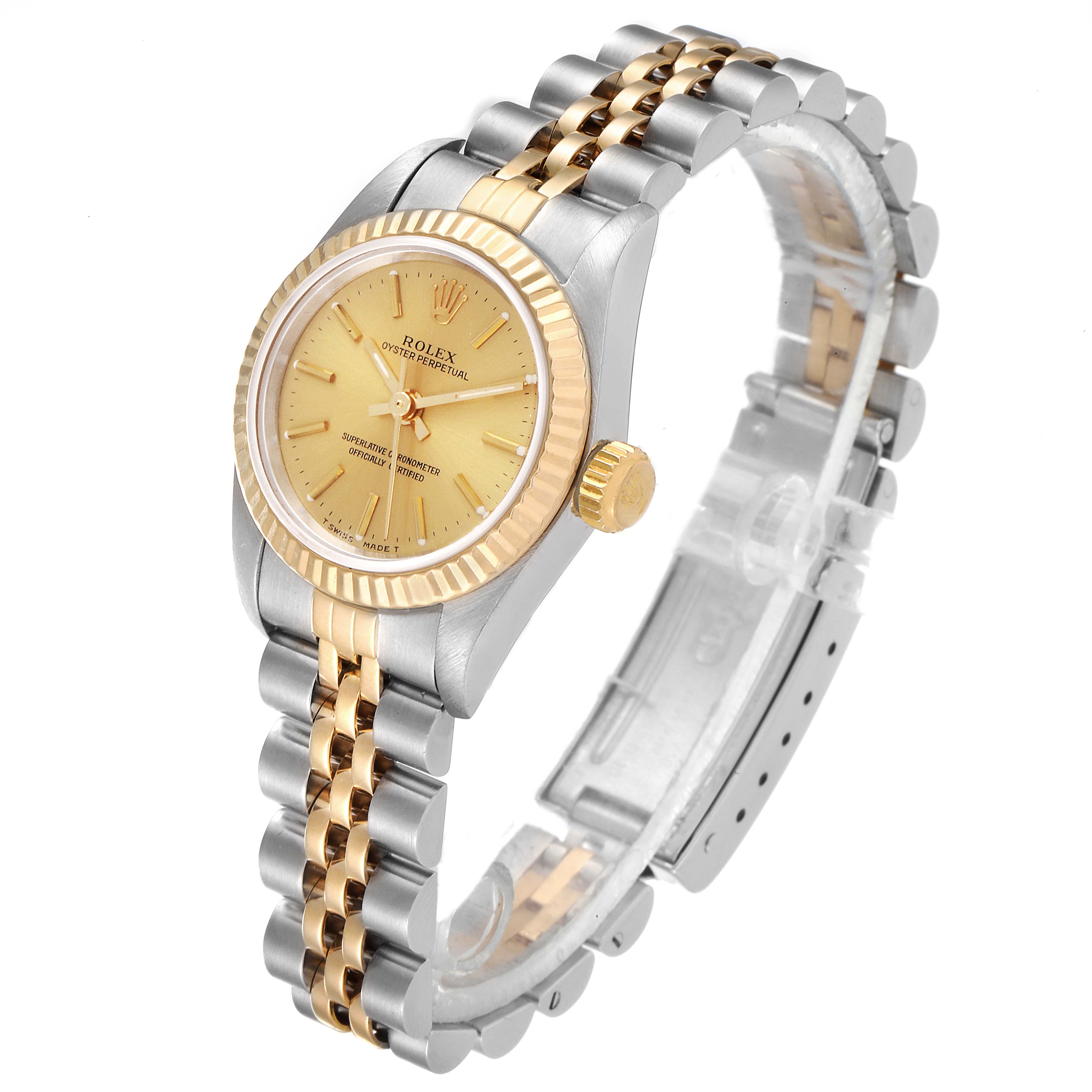 The Rolex Oyster Perpetual 67193 Women's Steel and Gold (two tone) Champagne Dial 67193 Women's Steel and Gold (two tone) Champagne Dial watch is shown from a three-quarter angle, displaying the face, bezel, crown, and bracelet.