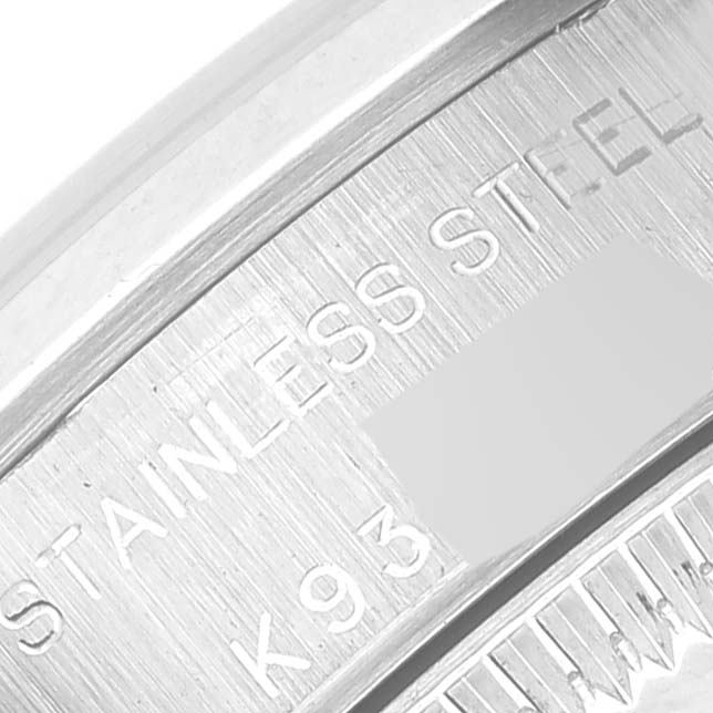 The image shows a close-up of the stainless steel casing of a Rolex Oyster Perpetual 76080 Women's Stainless Steel Silver Dial 76080 Women's Stainless Steel Silver Dial watch.