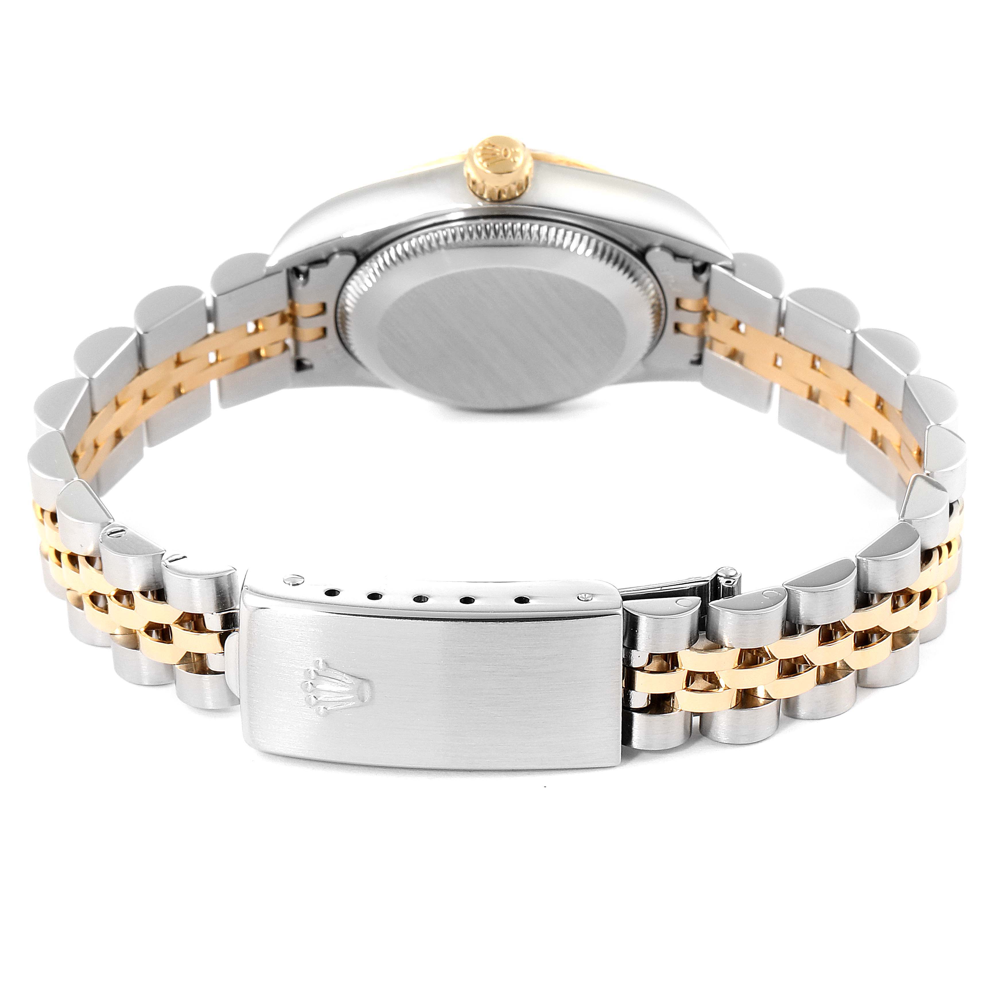 This image shows the back of the case, the crown, and the bracelet of the Rolex Oyster Perpetual 76193 Women's Steel and Gold (two tone) Silver Dial 76193 Women's Steel and Gold (two tone) Silver Dial watch.