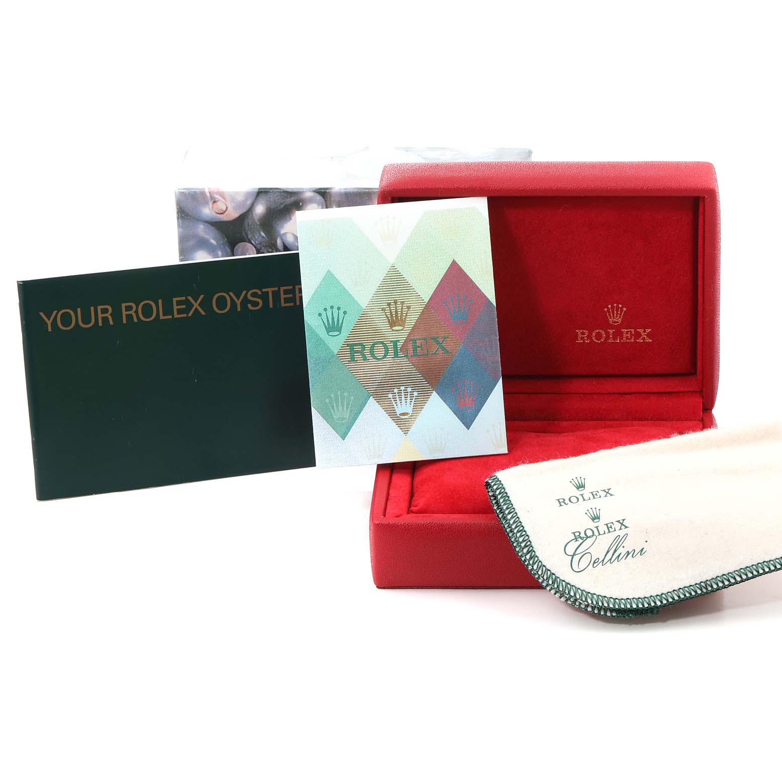 The image shows the accessories of a Rolex Oyster Perpetual 76193 Women's Steel and Gold (two tone) Silver Dial 76193 Women's Steel and Gold (two tone) Silver Dial watch, including its box, manuals, and cleaning cloth.