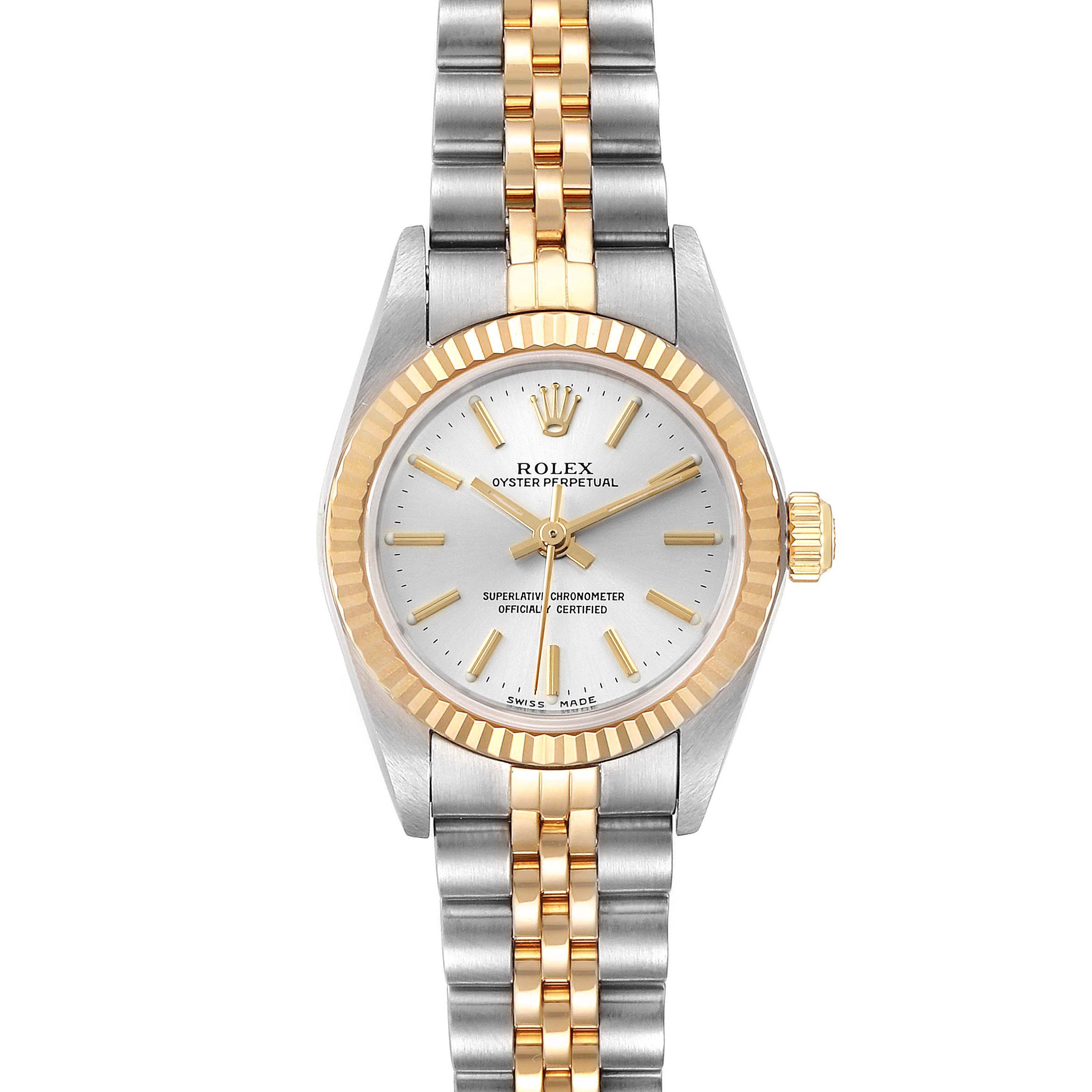 The image shows a front view of a Rolex Oyster Perpetual 76193 Women's Steel and Gold (two tone) Silver Dial 76193 Women's Steel and Gold (two tone) Silver Dial watch, highlighting its two-tone bracelet, bezel, and face.