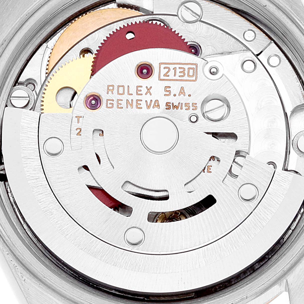 This close-up shows the intricate internal movement of the Rolex Oyster Perpetual 67193 Women's Steel and Gold (two tone) Champagne Dial 67193 Women's Steel and Gold (two tone) Champagne Dial watch, highlighting the rotor and gears.