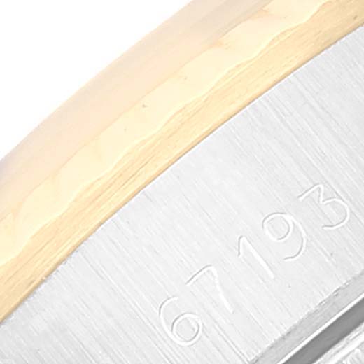 This image shows a close-up of the model number 67193 on the metal part of a Rolex Oyster Perpetual 67193 Women's Steel and Gold (two tone) Champagne Dial 67193 Women's Steel and Gold (two tone) Champagne Dial watch.
