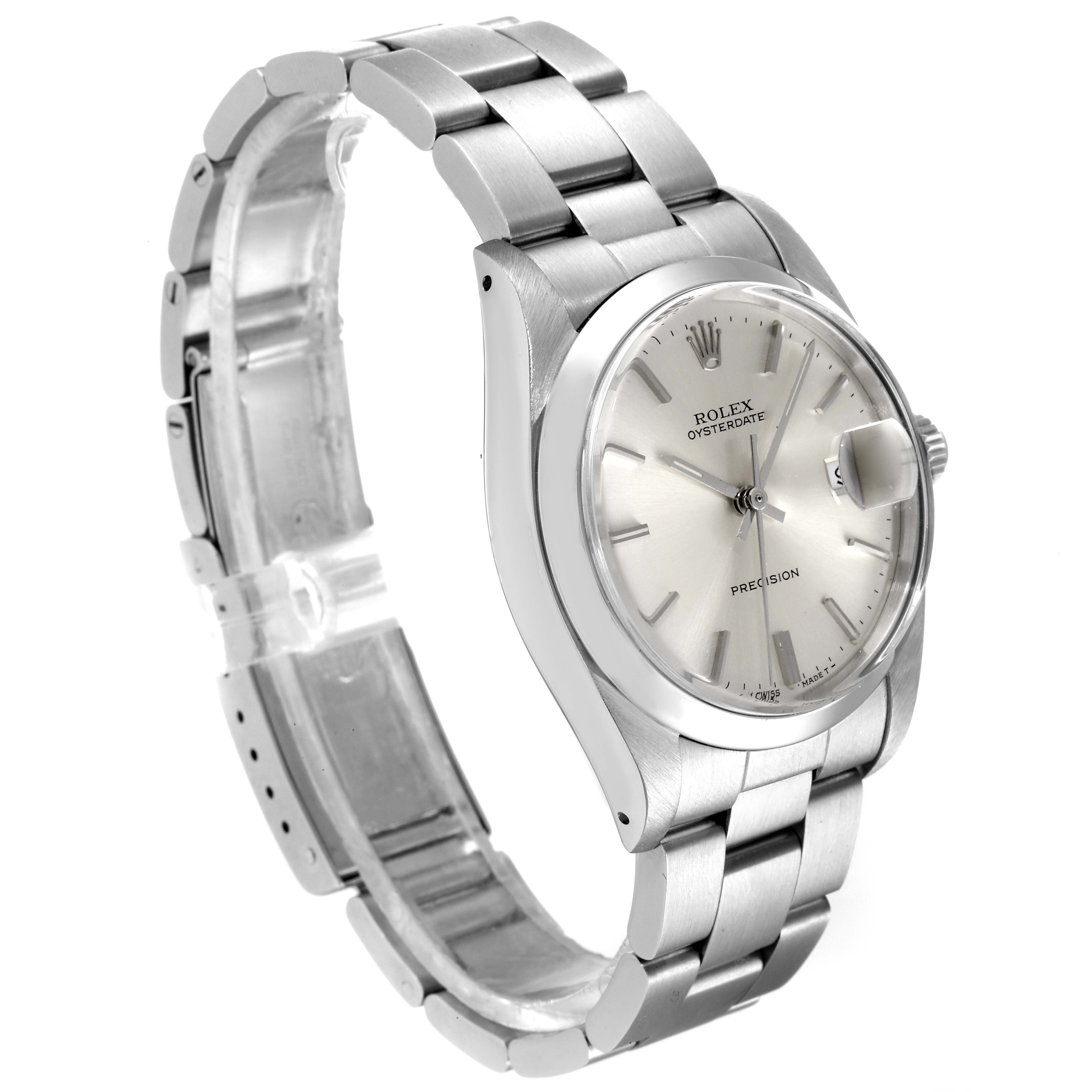 The image shows a side angle of the Rolex Vintage Collection 6694 Men's Stainless Steel Silver Dial 6694 Men's Stainless Steel Silver Dial Oysterdate watch, highlighting the silver case, dial, and bracelet.