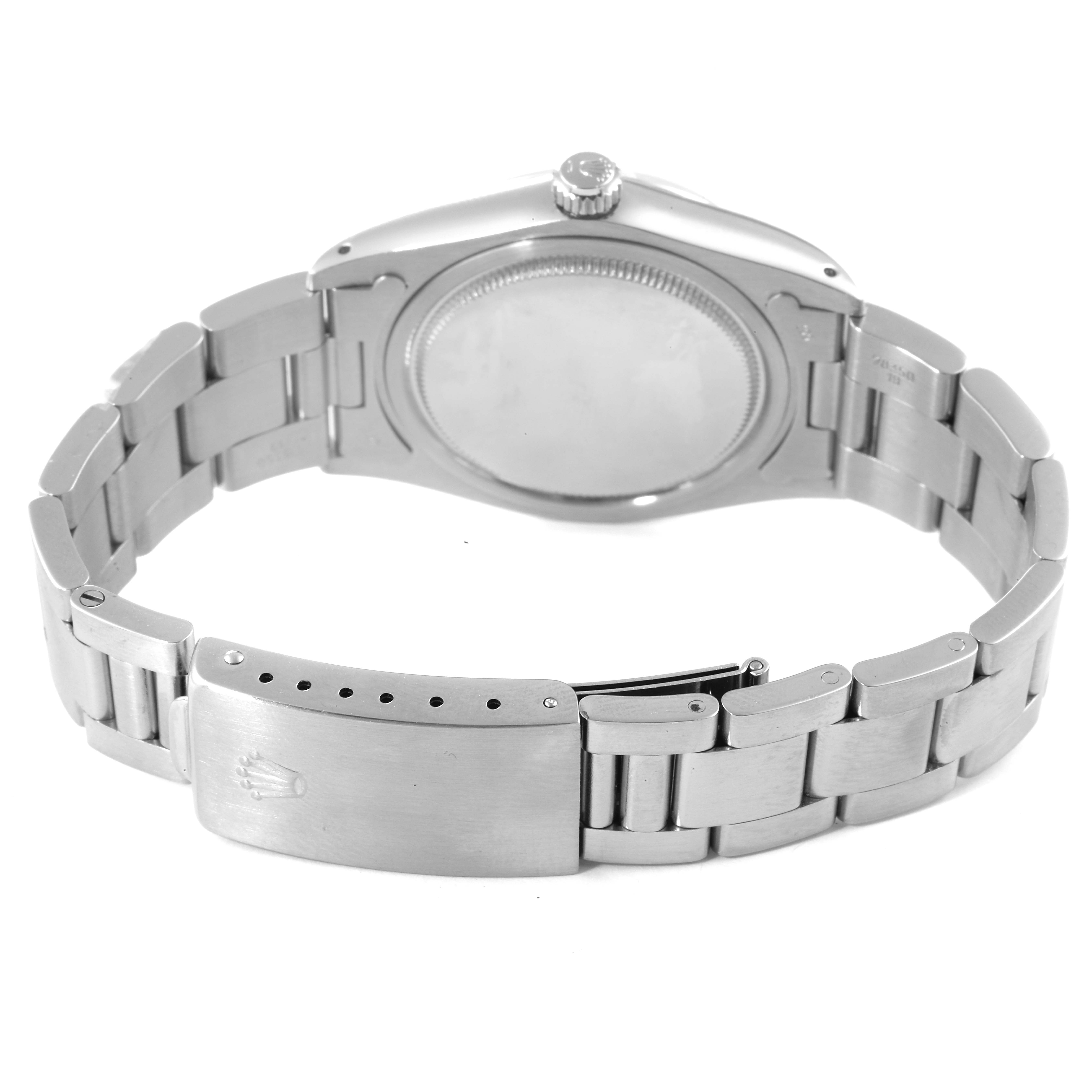 The image shows a rear view of a Rolex Vintage Collection 6694 Men's Stainless Steel Silver Dial 6694 Men's Stainless Steel Silver Dial watch, highlighting its bracelet, clasp, and case back.