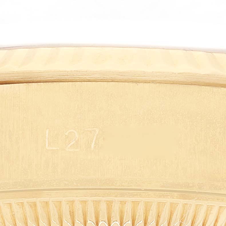 This image shows a close-up of the gold bezel with a fluted design on a Rolex President 69178 Women's Yellow Gold Champagne Dial 69178 Women's Yellow Gold Champagne Dial model watch.