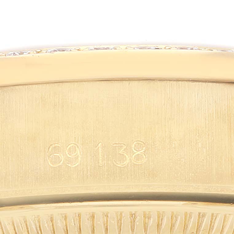 This close-up image shows the serial number engraved on the side of a Rolex President 69138 Women
s Yellow Gold Champagne Dial 69138 Women
s Yellow Gold Champagne Dial model watch.