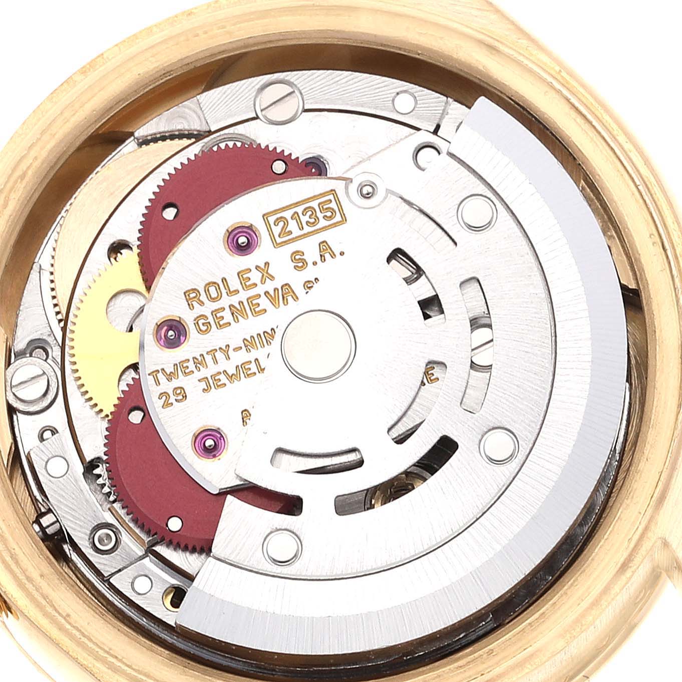 This image shows the open, intricate movement of a Rolex President 69138 Women
s Yellow Gold Champagne Dial 69138 Women
s Yellow Gold Champagne Dial model watch, displaying gears and jewels.