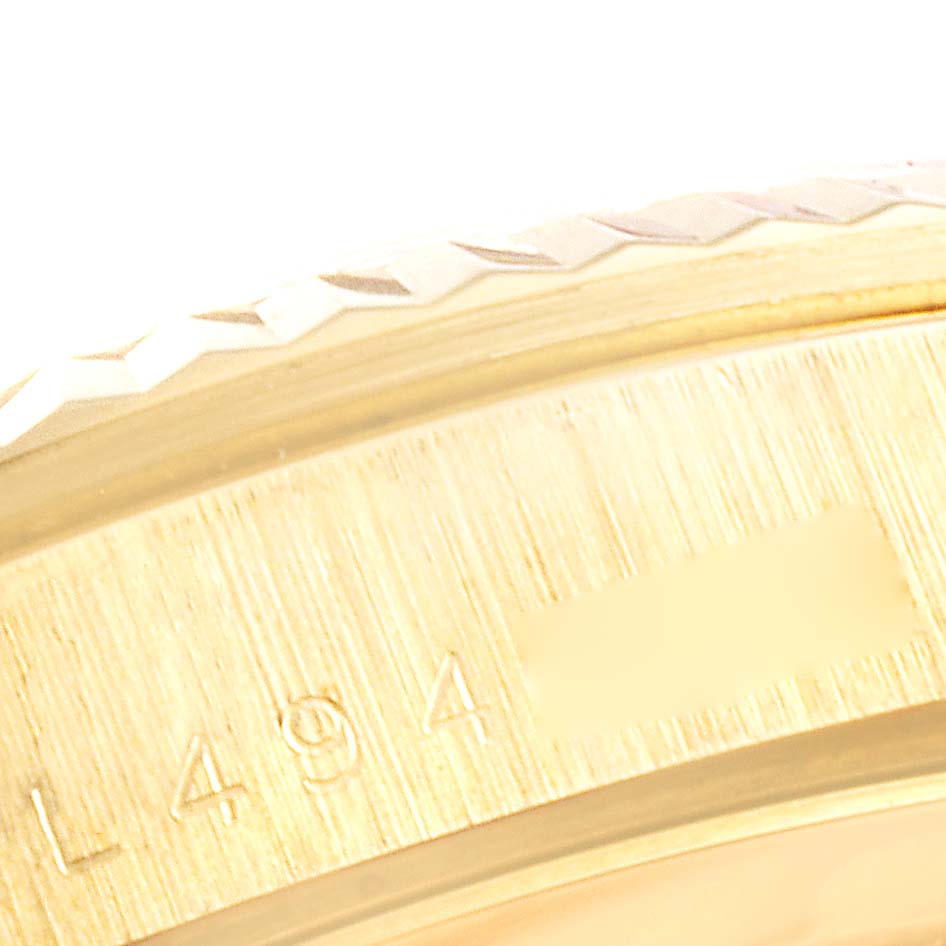 The image shows a close-up of the bezel and part of the case of a Rolex President 18238 Men's Yellow Gold Black Dial 18238 Men's Yellow Gold Black Dial model watch.