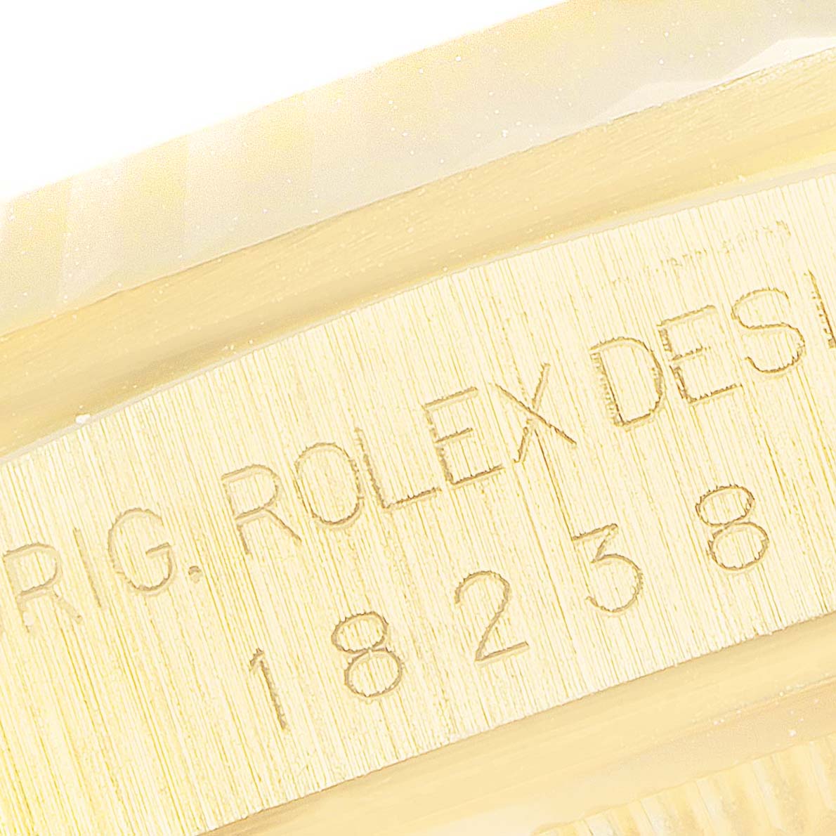 The image shows the inner engraving of a Rolex President 18238 Men's Yellow Gold Black Dial 18238 Men's Yellow Gold Black Dial model watch, highlighting the model number 18238.