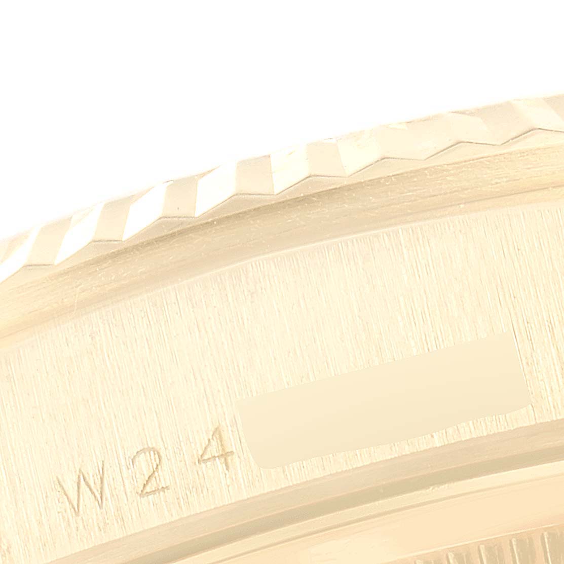The image shows a close-up of the bezel and a portion of the case side of a Rolex President 18238 Men
s Yellow Gold Champagne Dial 18238 Men
s Yellow Gold Champagne Dial model watch.