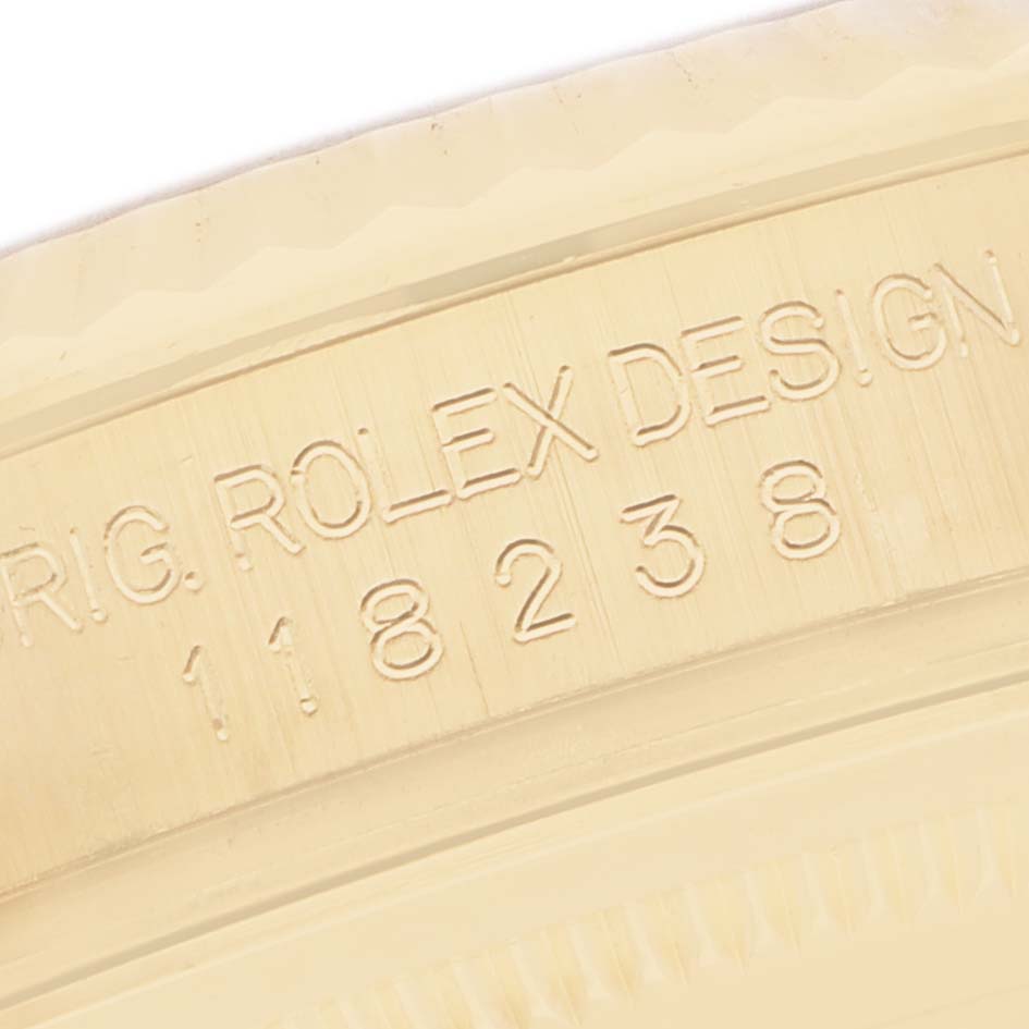 The image shows an engraved side detail of a Rolex President 118238 Men's Yellow Gold Mother of Pearl Dial model, displaying the model and design information.