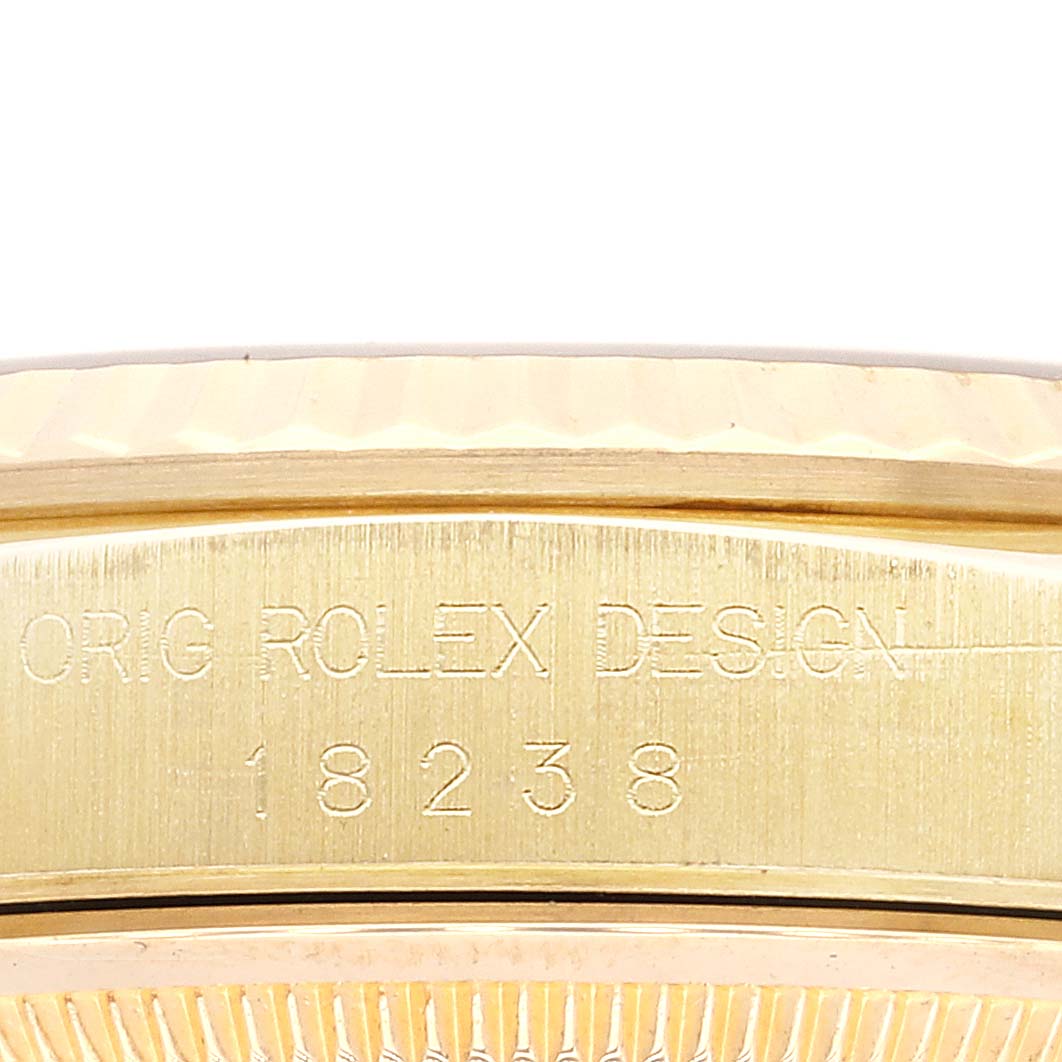This close-up shows the engraved model number on the side of the case of a Rolex President 18238 Men
s Yellow Gold Blue Dial 18238 Men
s Yellow Gold Blue Dial model watch.