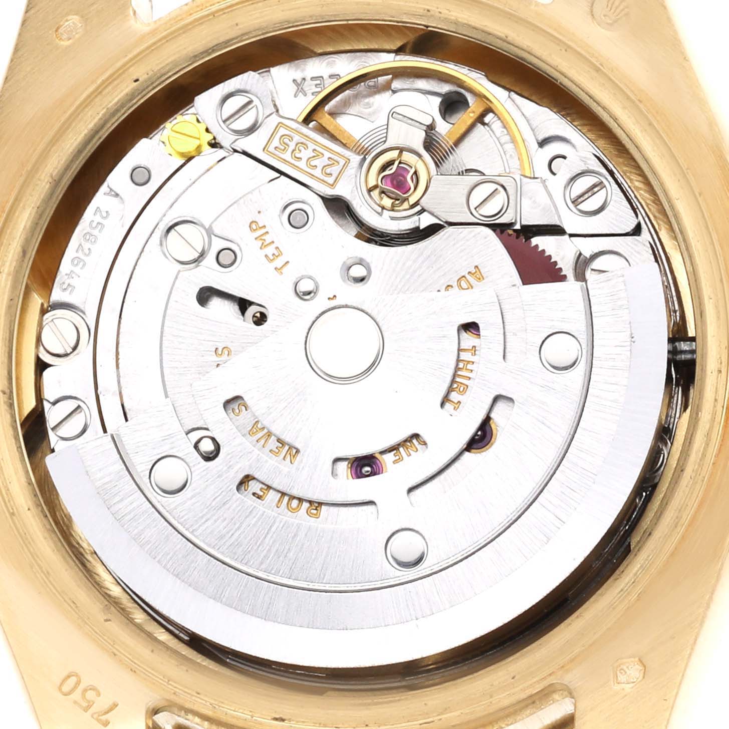 The image shows the movement of a Rolex President 179238 Women's Yellow Gold Champagne Dial model viewed from the back, displaying the rotor and intricate mechanical components.