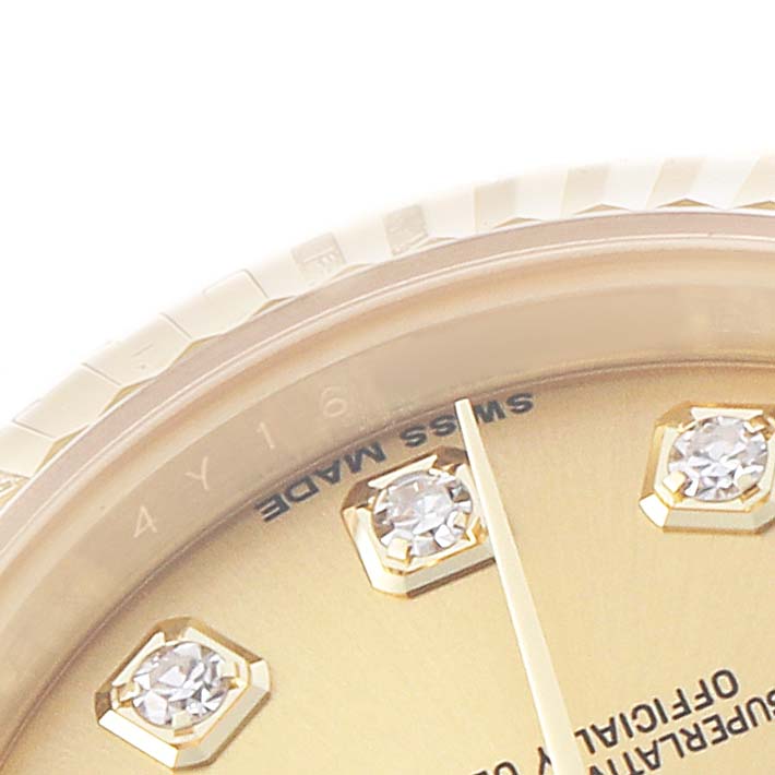 The image shows a close-up of the dial, bezel, and diamond markers of a Rolex President 179238 Women's Yellow Gold Champagne Dial watch, partially displaying "SWISS MADE."