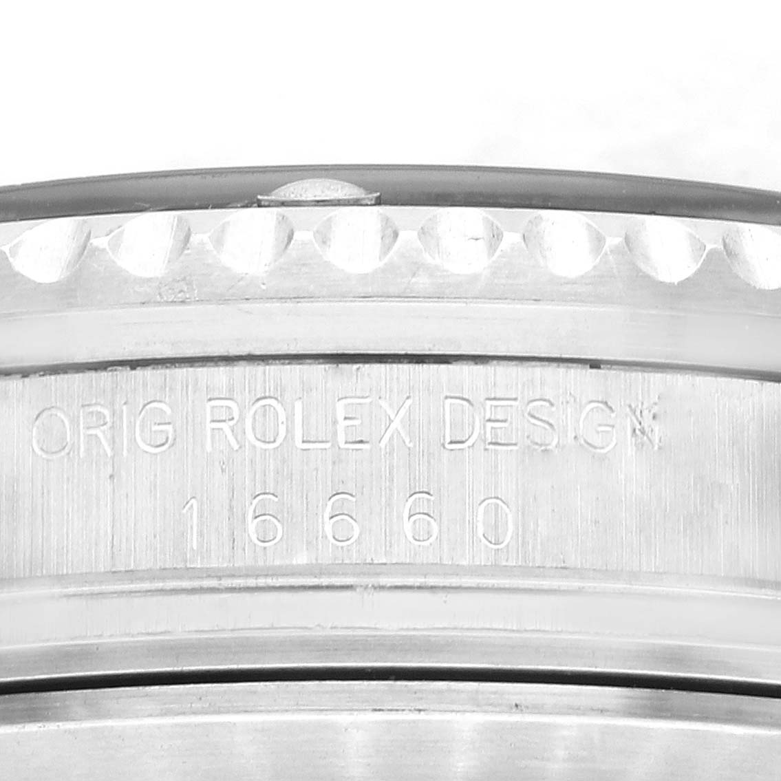 The image shows a close-up of the side of a Rolex Vintage Collection 16660 Men's Stainless Steel Black Dial 16660 Men's Stainless Steel Black Dial watch, highlighting the "Orig Rolex Design" engraving and model number 16660.