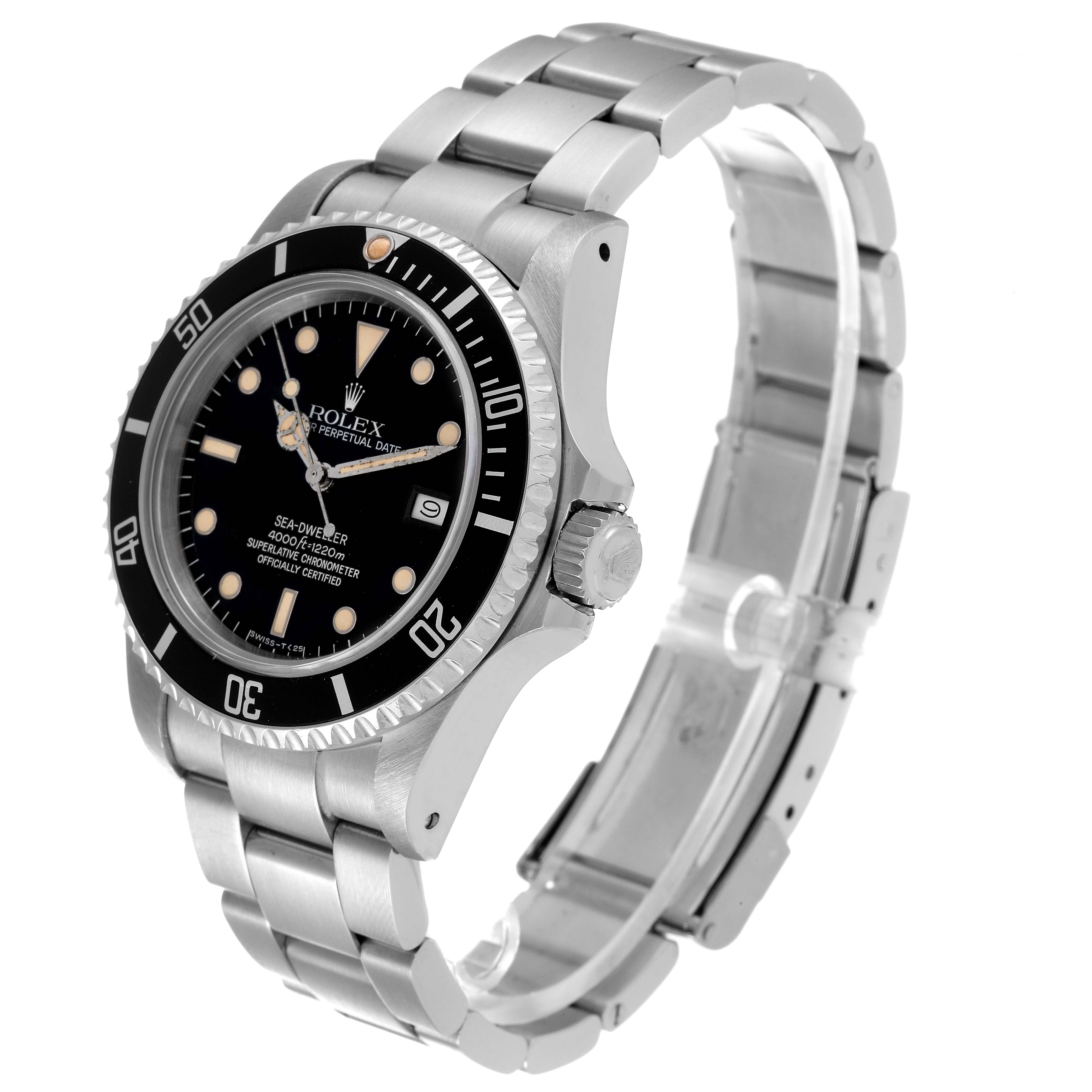 The Vintage Collection Rolex watch is shown at a three-quarter angle, highlighting the face, bezel, and metal bracelet.