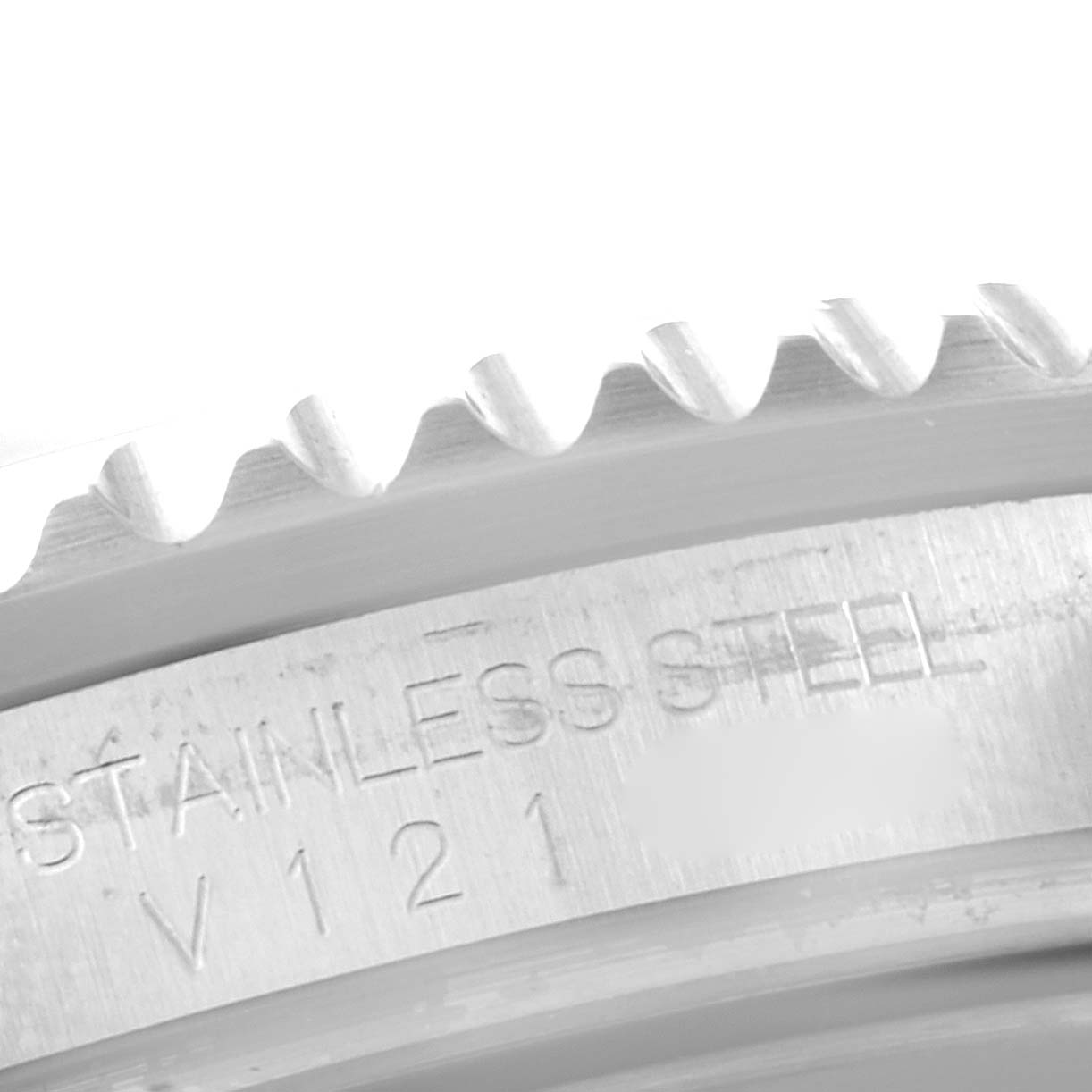 This close-up image shows the engraved stainless steel bezel edge and part of the casing of the Rolex Submariner 16610 Men
s Stainless Steel Black Dial 16610 Men
s Stainless Steel Black Dial watch.