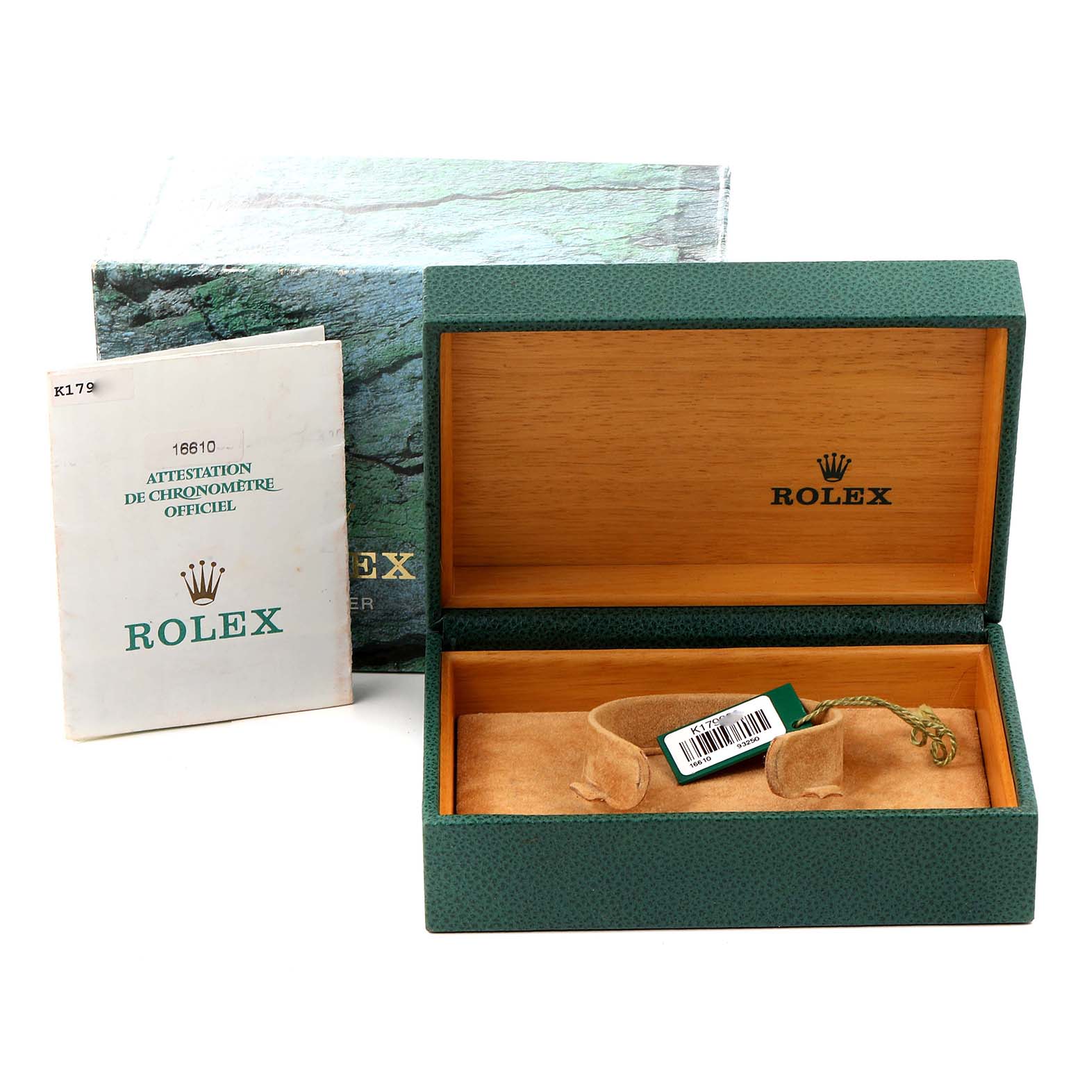 The image shows an empty Rolex Submariner 16610 Men
s Stainless Steel Black Dial 16610 Men
s Stainless Steel Black Dial watch box, a booklet, and a hang tag.