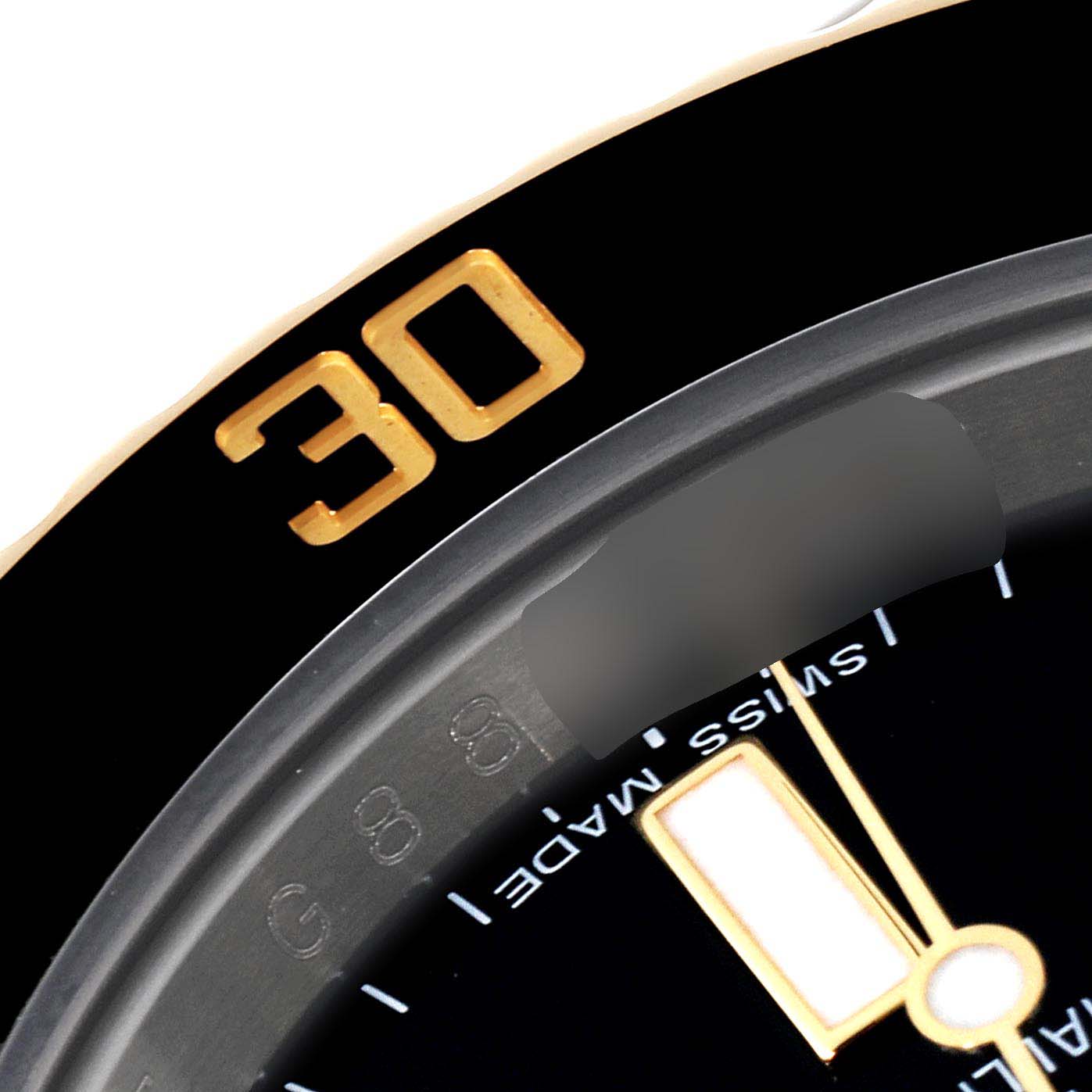 The image shows a close-up of the bezel and part of the dial with the "Swiss Made" text on a Rolex Submariner 116613 Men's Steel and Gold (two tone) Black Dial 116613 Men's Steel and Gold (two tone) Black Dial watch.