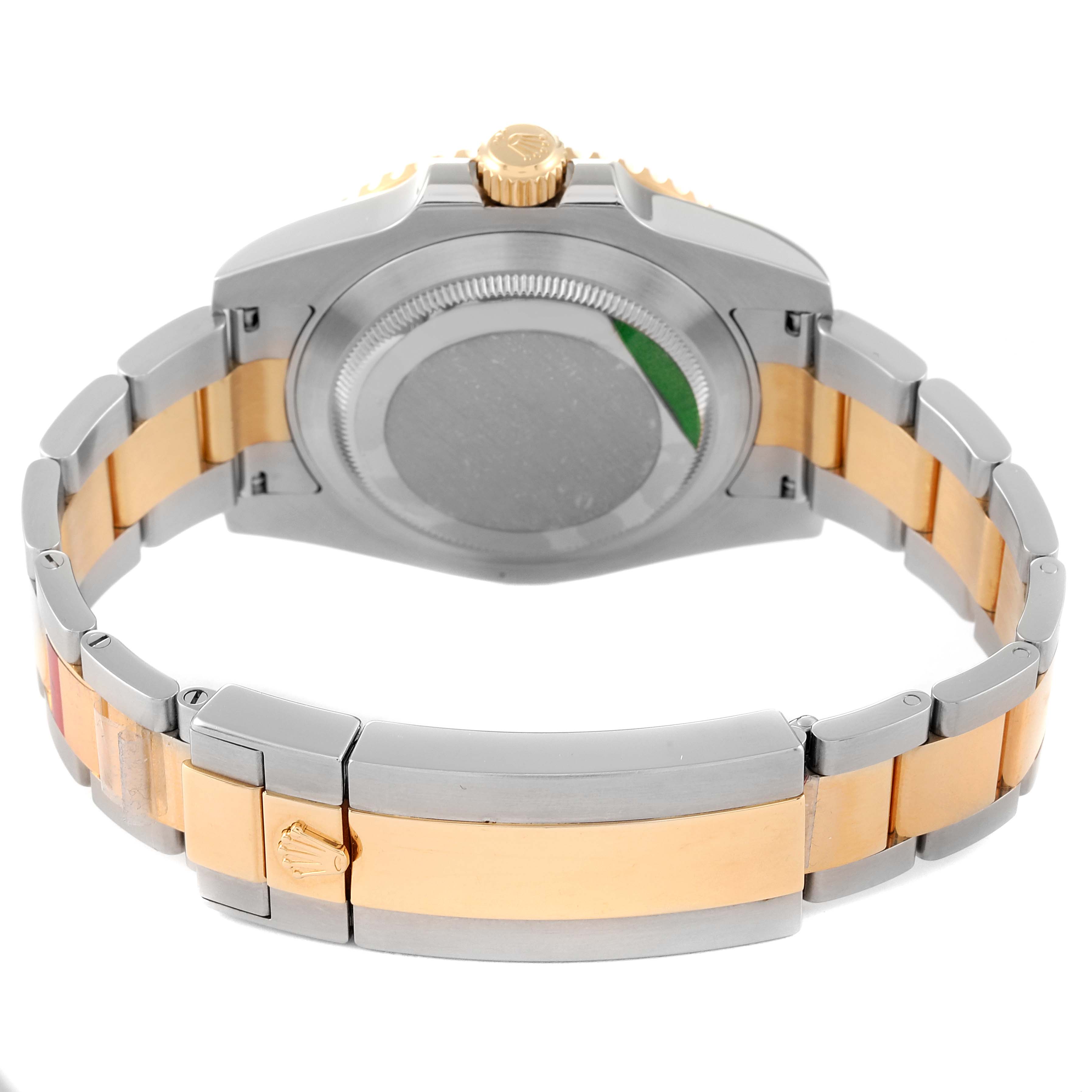 The image shows the back view of a Rolex Submariner 116613 Men's Steel and Gold (two tone) Black Dial 116613 Men's Steel and Gold (two tone) Black Dial watch, highlighting the two-tone metal bracelet and watch case.