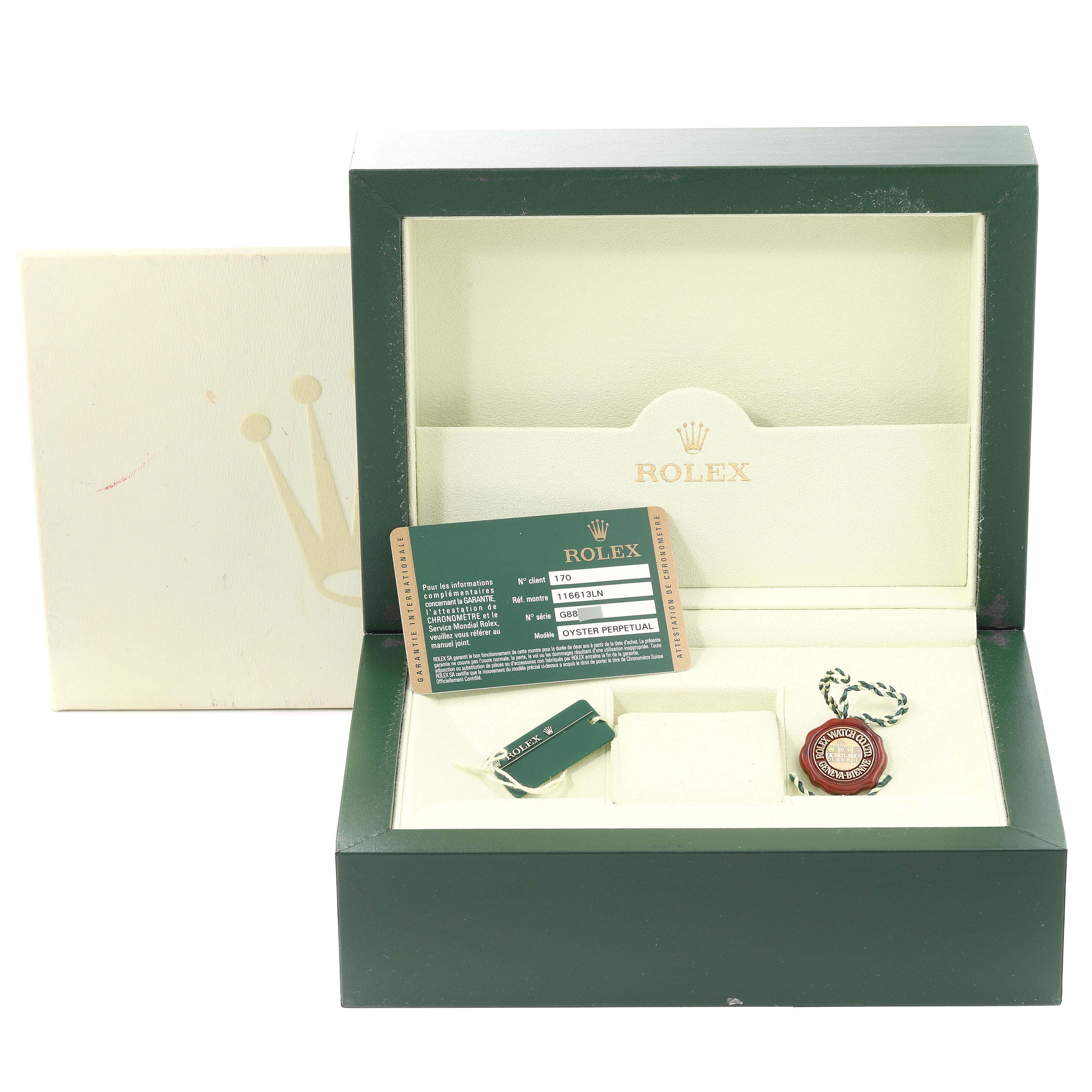 The image shows the open box of a Rolex Submariner 116613 Men's Steel and Gold (two tone) Black Dial 116613 Men's Steel and Gold (two tone) Black Dial with accessories like tags and certification card.