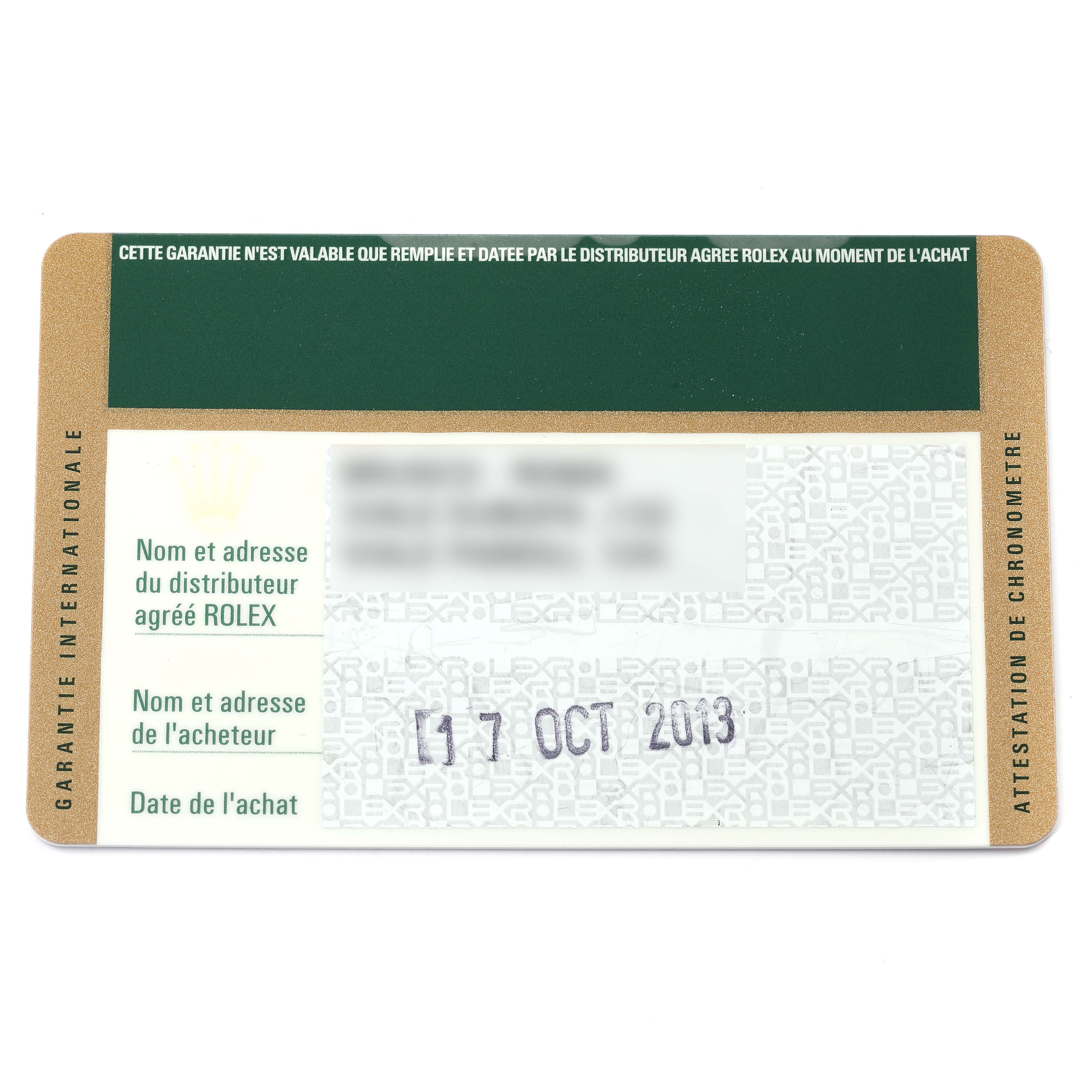 This image shows the warranty card and purchase date for a Rolex Submariner 116613 Men's Steel and Gold (two tone) Black Dial 116613 Men's Steel and Gold (two tone) Black Dial watch.