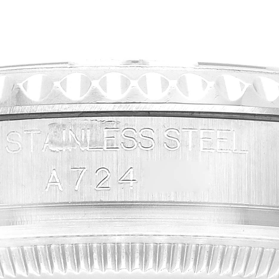 The image shows a close-up of the engraved stainless steel of a Rolex Yacht-Master 168622 Men's Stainless Steel Silver Dial 168622 Men's Stainless Steel Silver Dial watch.