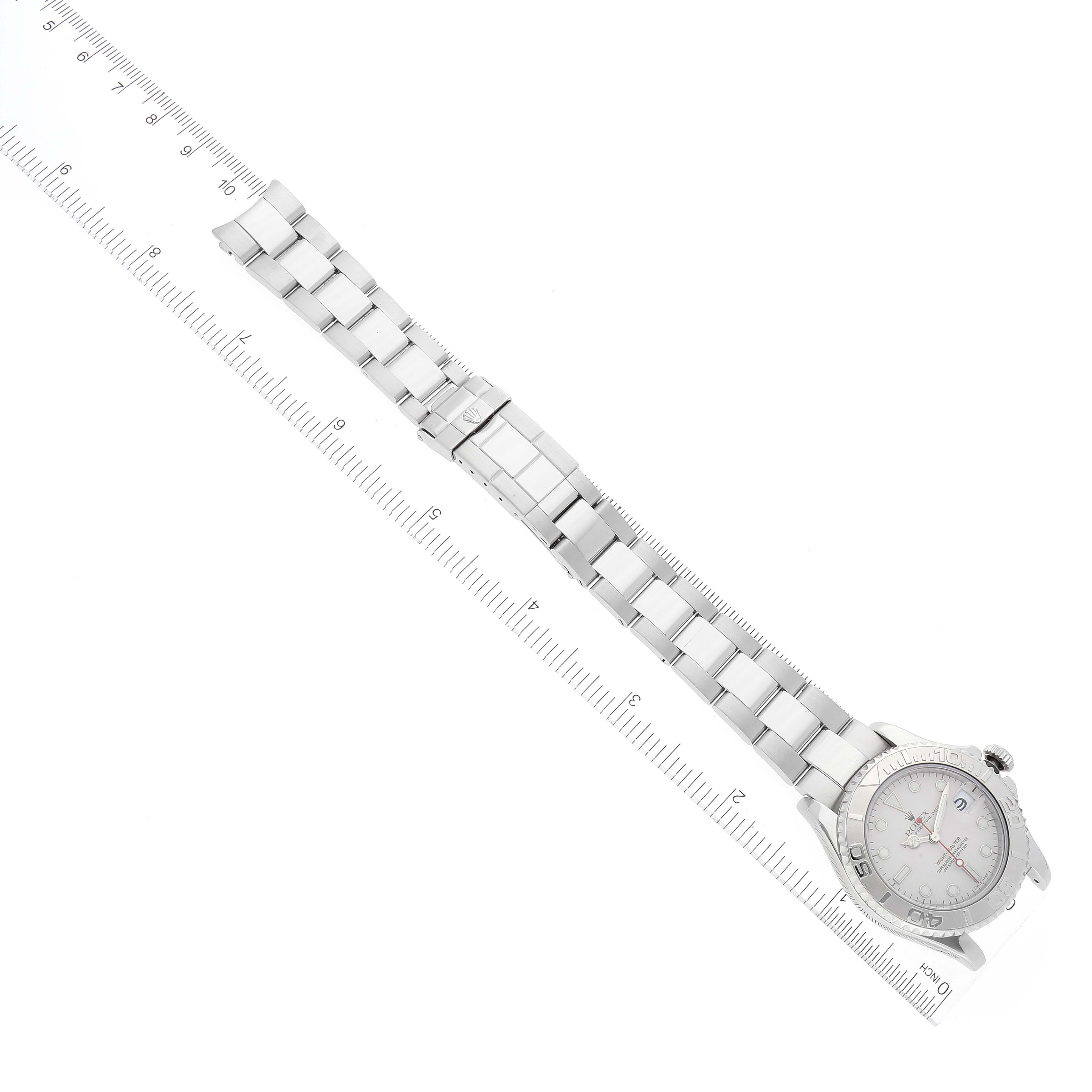 The image shows a Rolex Yacht-Master 168622 Men's Stainless Steel Silver Dial 168622 Men's Stainless Steel Silver Dial watch laid flat, with the strap extended and positioned next to a measurement ruler for scale.