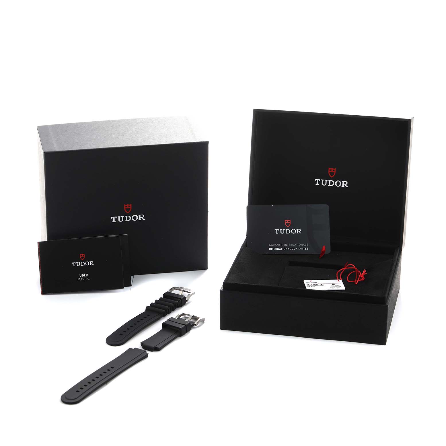 The image shows Tudor Pelagos 2543C Men's Titanium Black Dial packaging with a box, user manual, warranty card, and interchangeable watch straps.