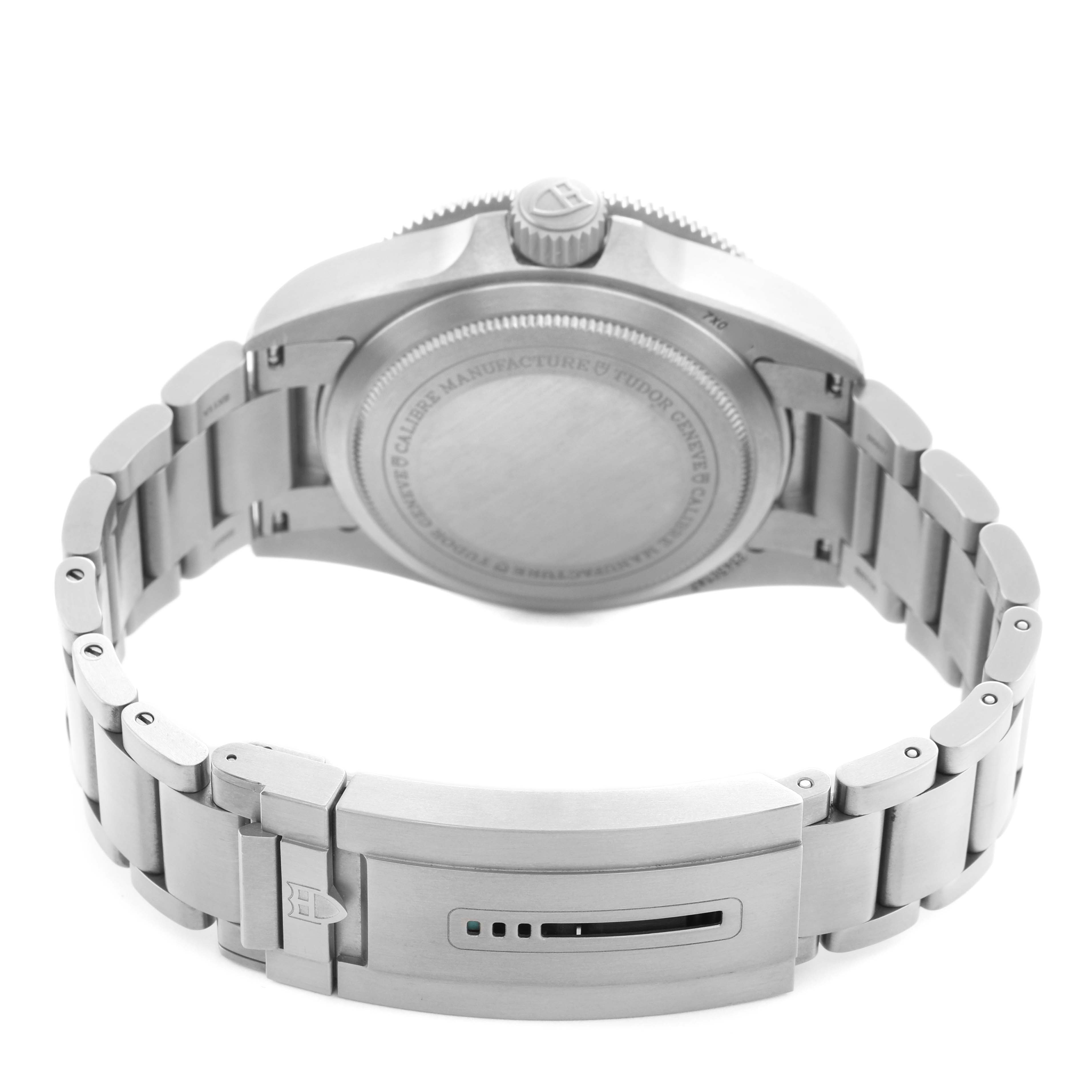 The image shows the Tudor Pelagos 2543C Men's Titanium Black Dial watch from the back, highlighting the clasp, bracelet, and case back.