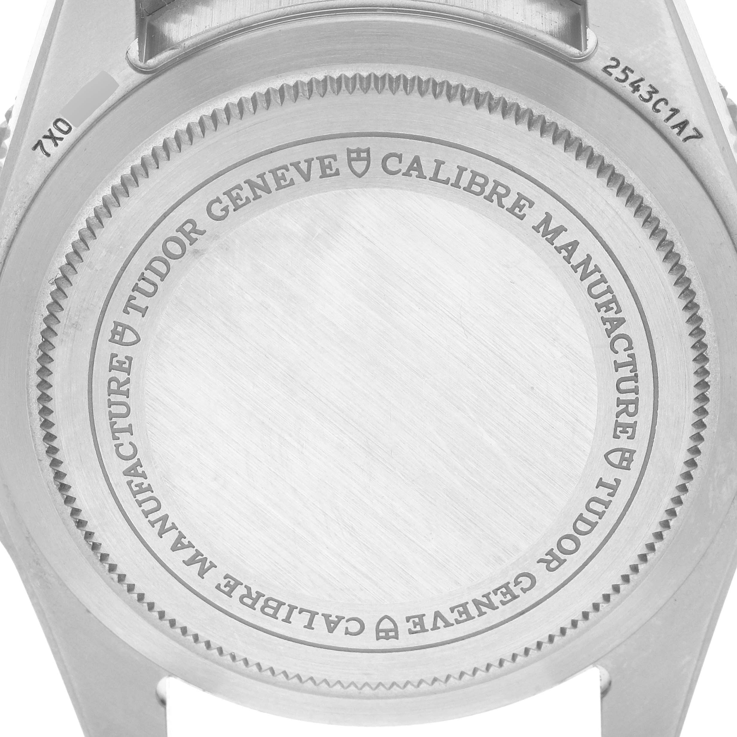 The image shows the back case of a Tudor Pelagos 2543C Men's Titanium Black Dial watch, displaying the brand's engraving and model details.